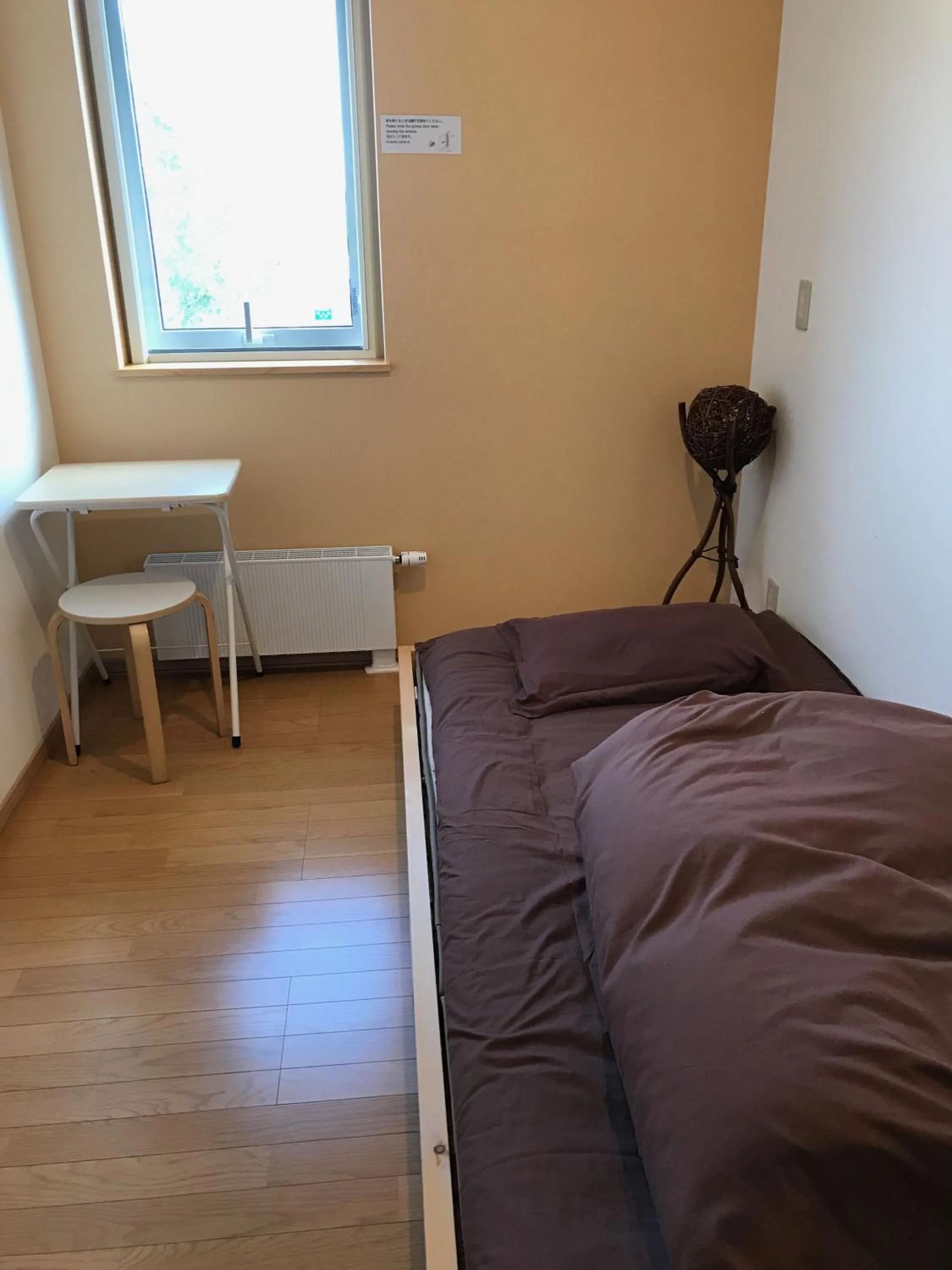 Bed in Niseko Guesthouse Nalu.