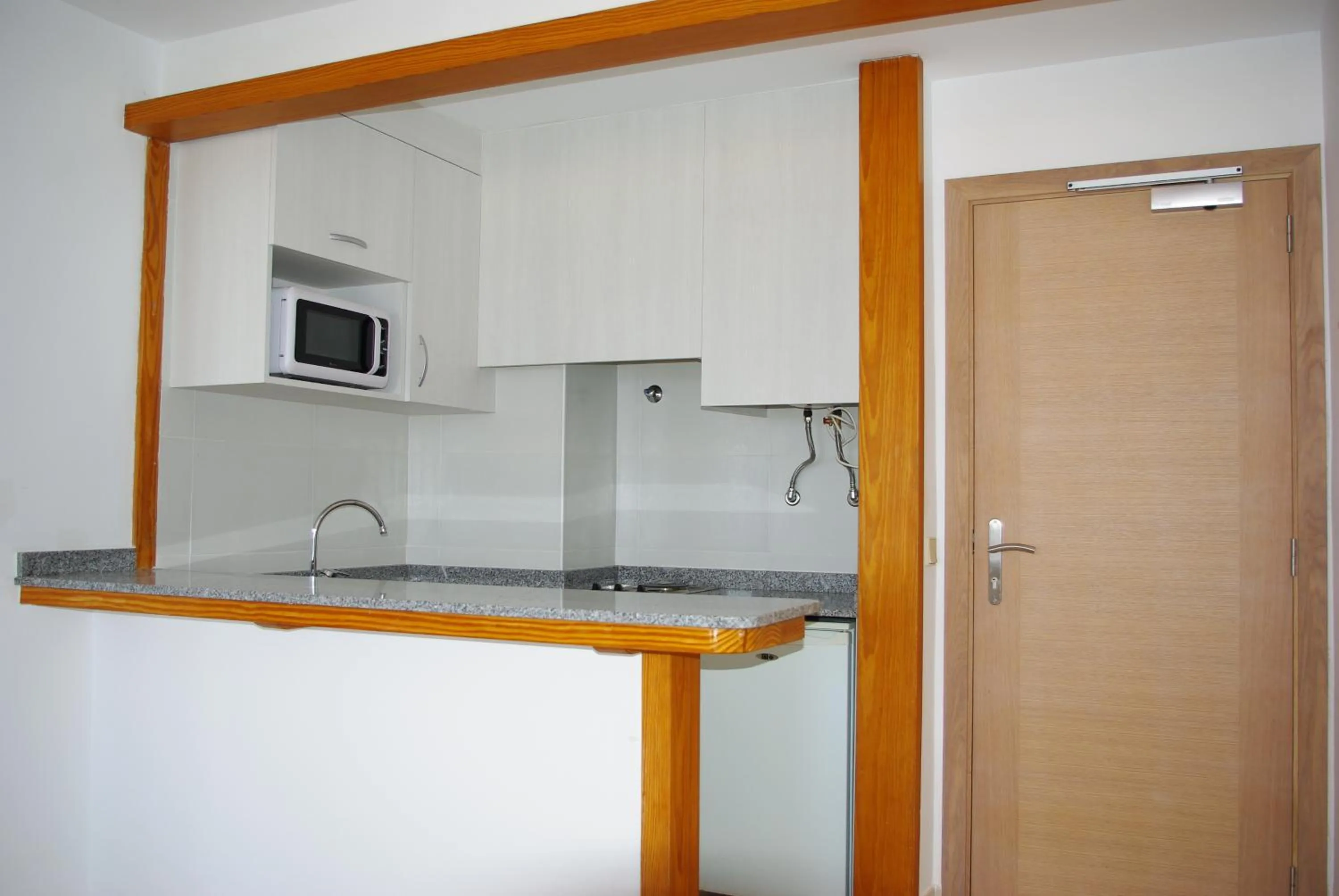 Kitchen or kitchenette in Apartamentos Embat