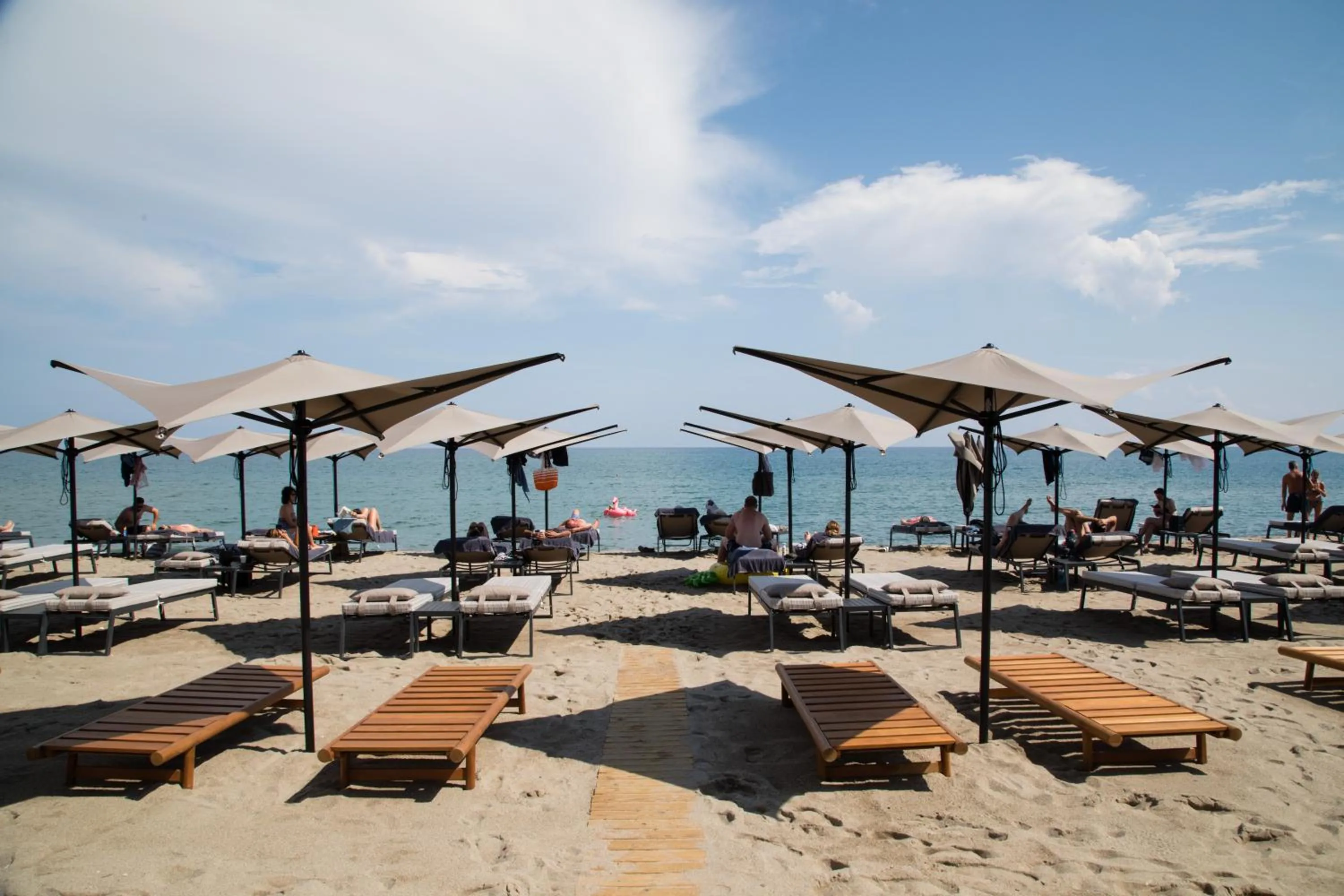 Beach in Ikones Seafront Luxury Suites