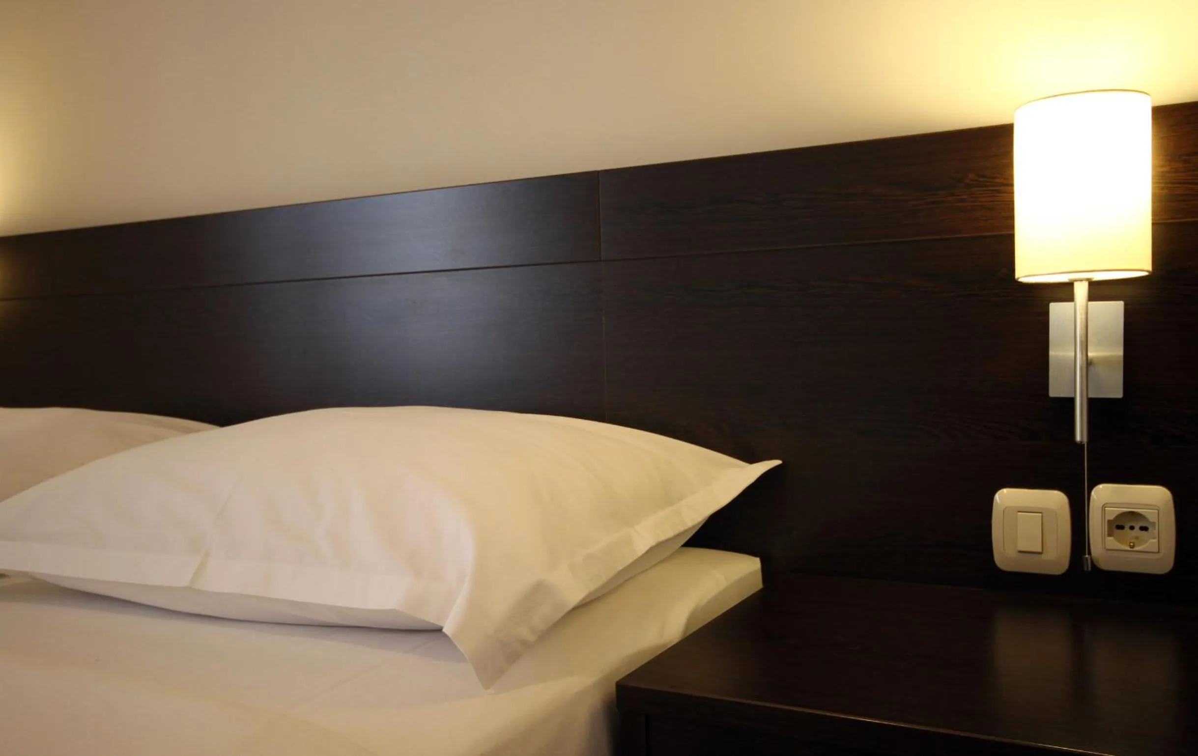 Bed in Lucic Rooms & Suites