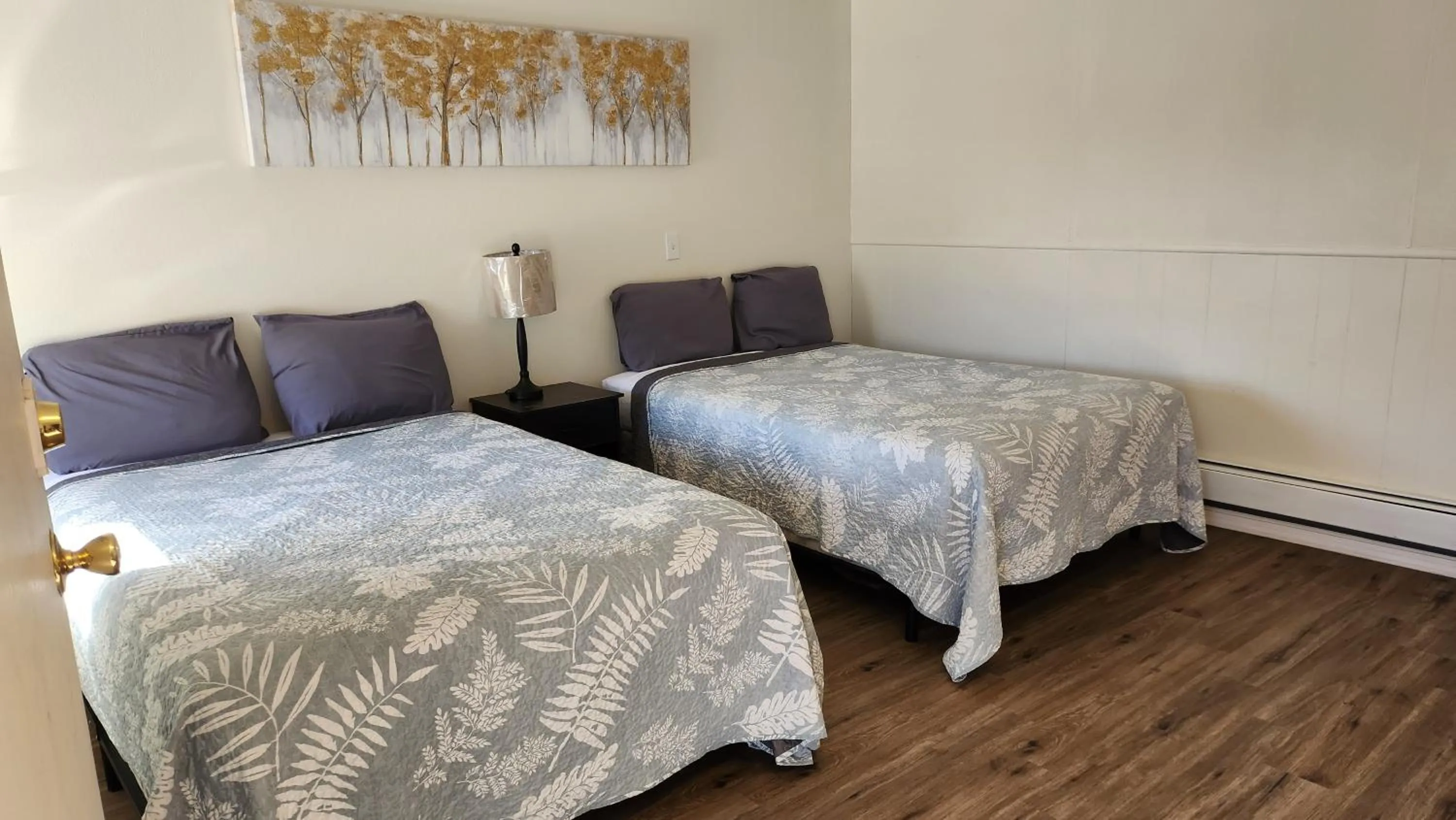 Bed in Golden Arrow Motel