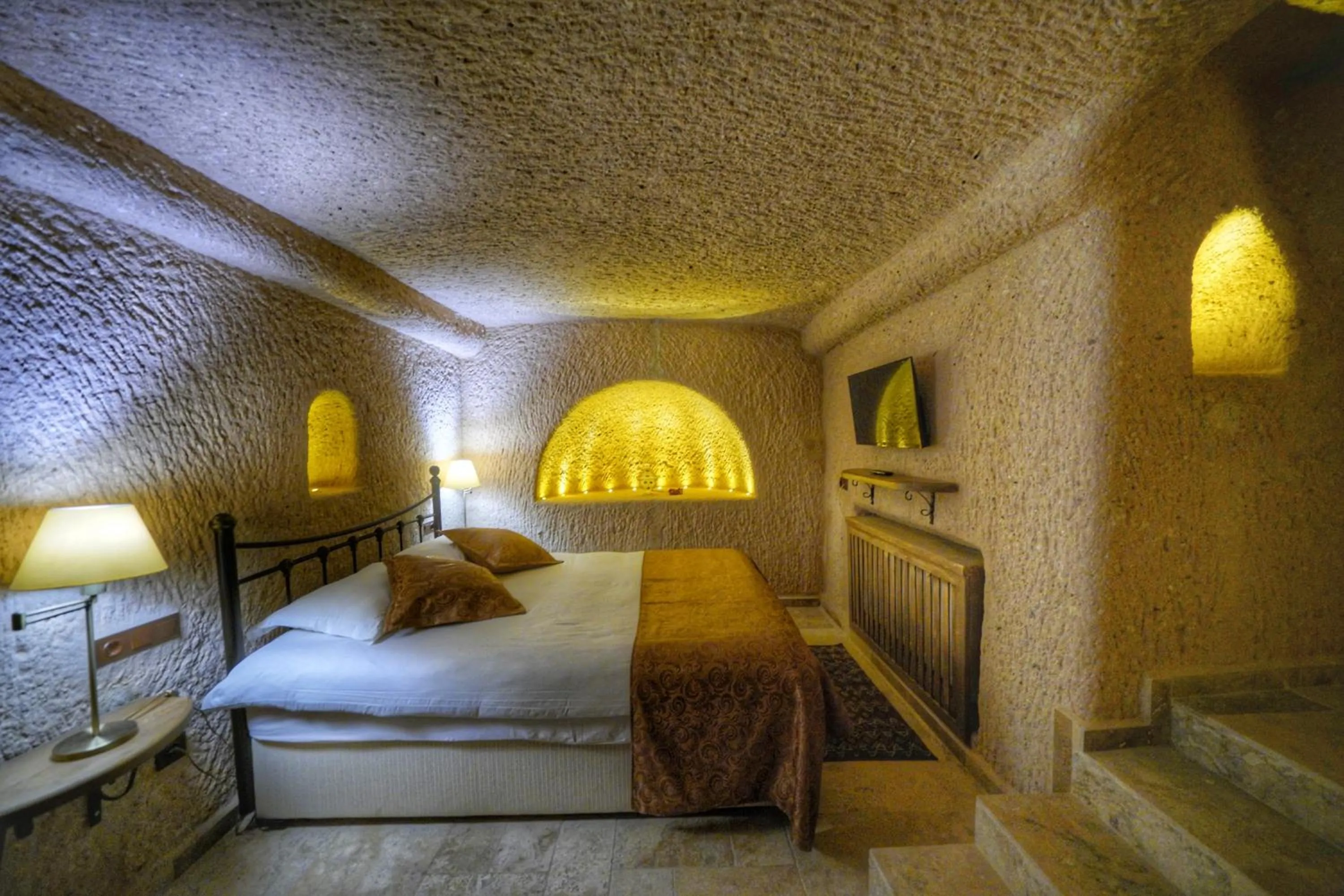 Bed in Takaev Cave House