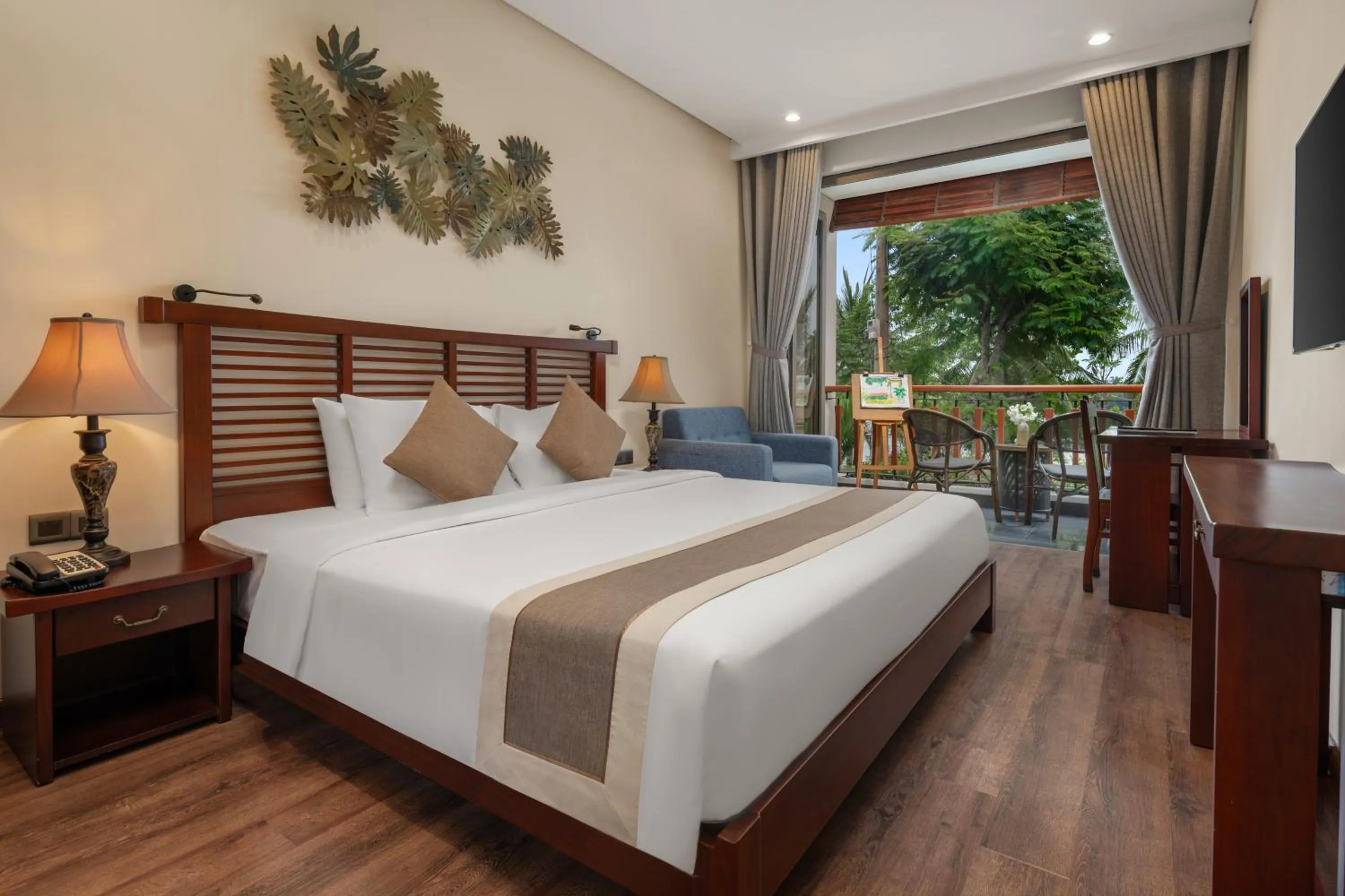 Bed in Silk Sense Hoi An River Resort - Green Luxury Escape
