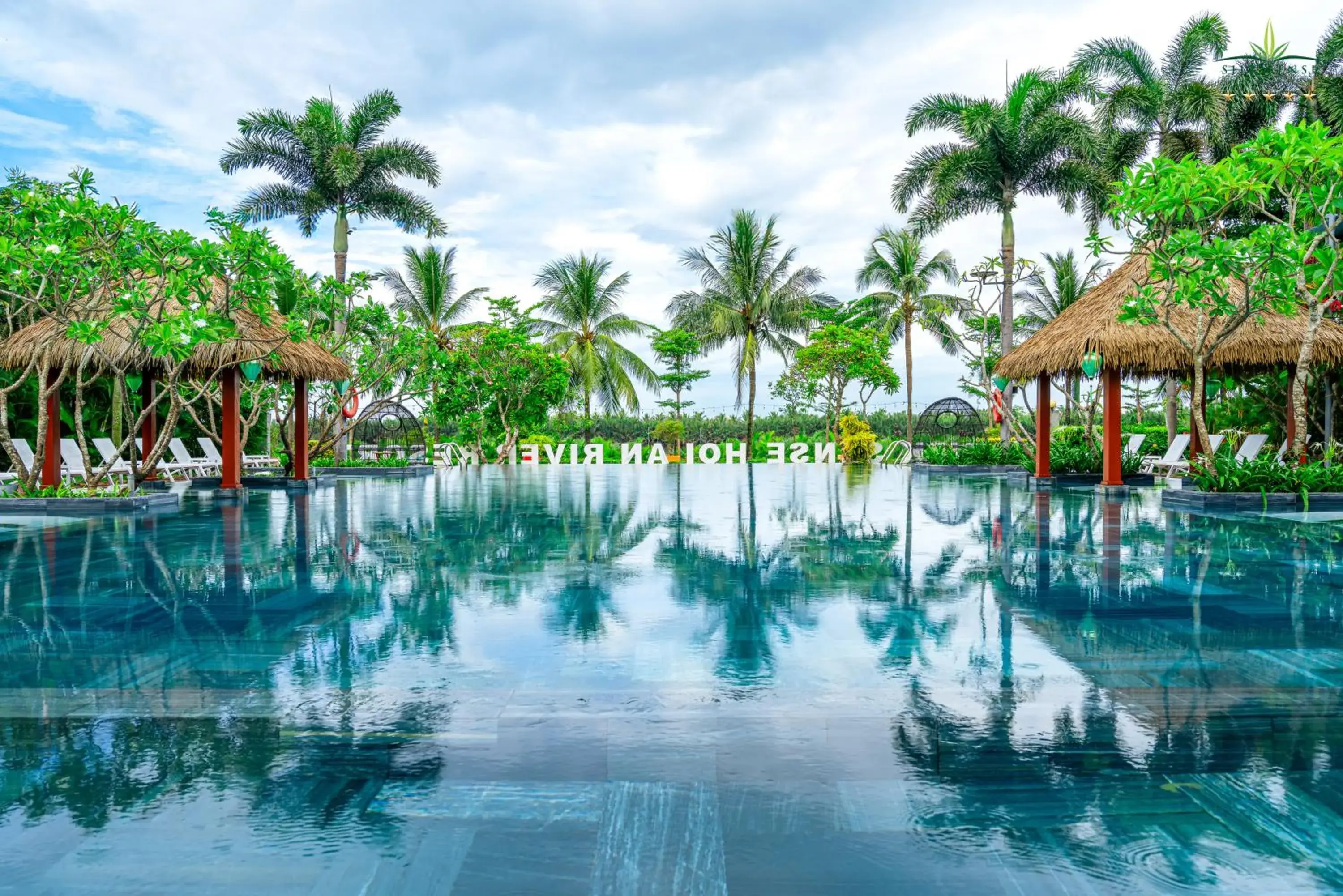 Pool view in Silk Sense Hoi An River Resort - Green Luxury Escape Pool view in Silk Sense Hoi An River Resort - Green Luxury Escape