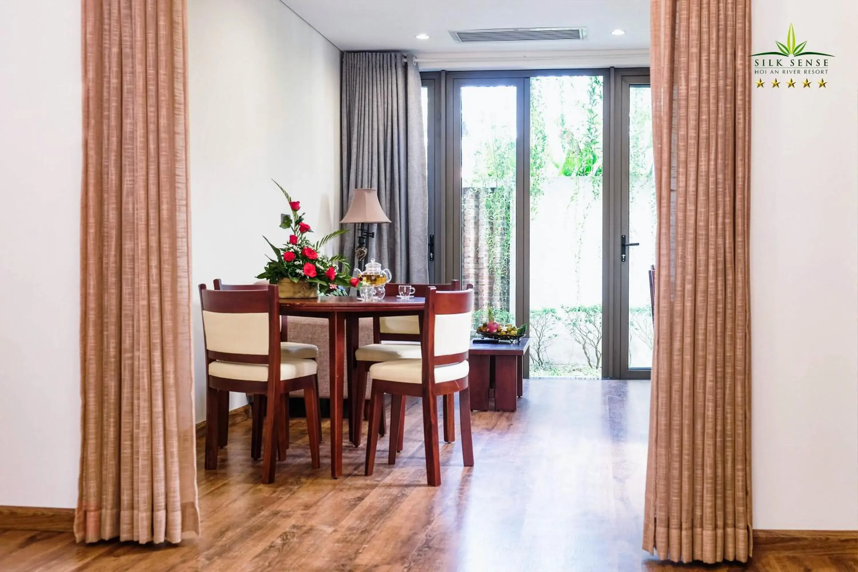Living room in Silk Sense Hoi An River Resort - A Sustainable Destination Living room in Silk Sense Hoi An River Resort - A Sustainable Destination