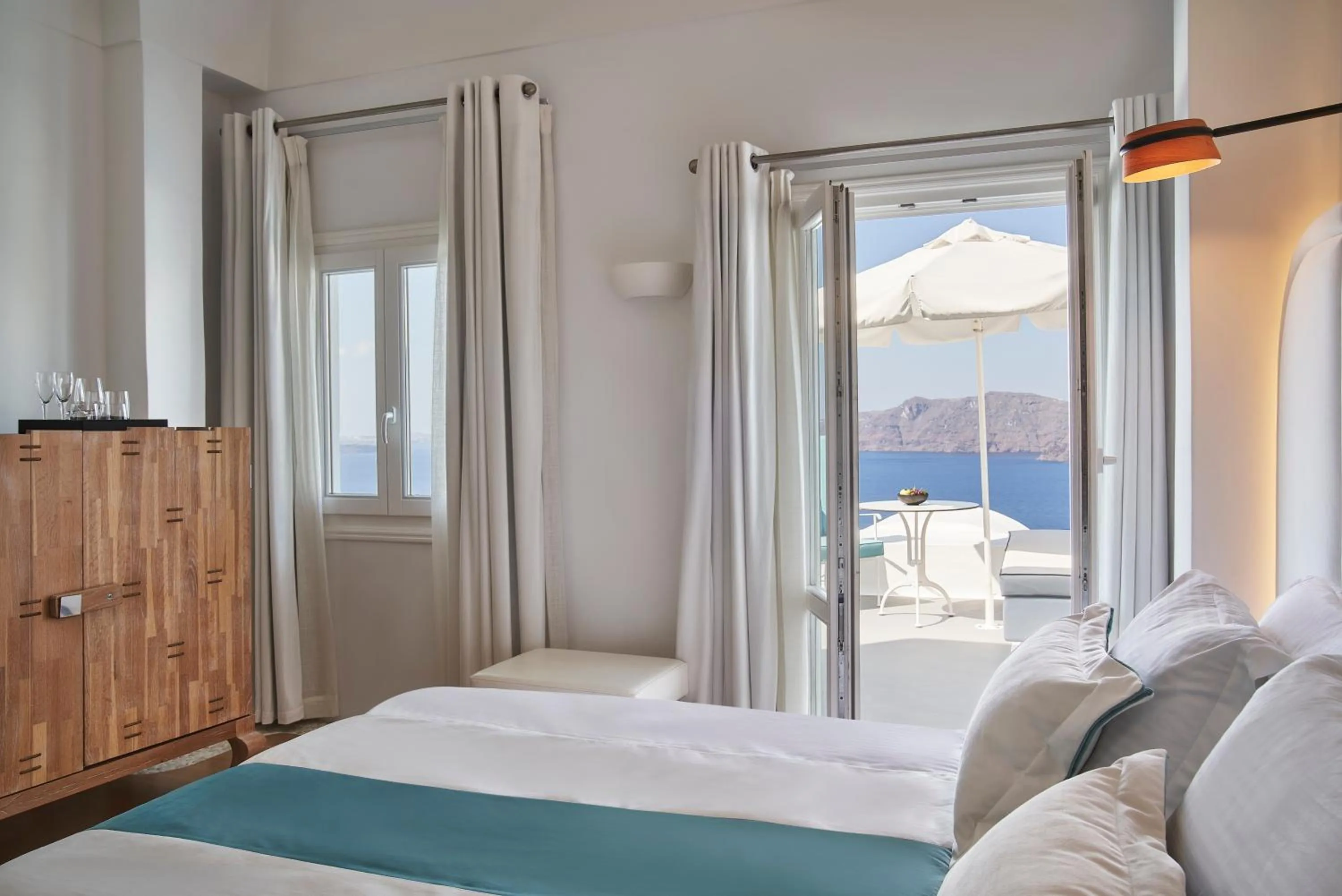 Photo of the whole room, Bed in Katikies Kirini Santorini - The Leading Hotels Of The World