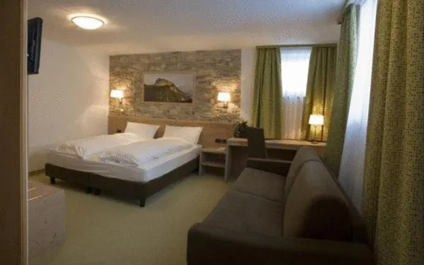 Bed in Ciasa Alpina Relax Hotel