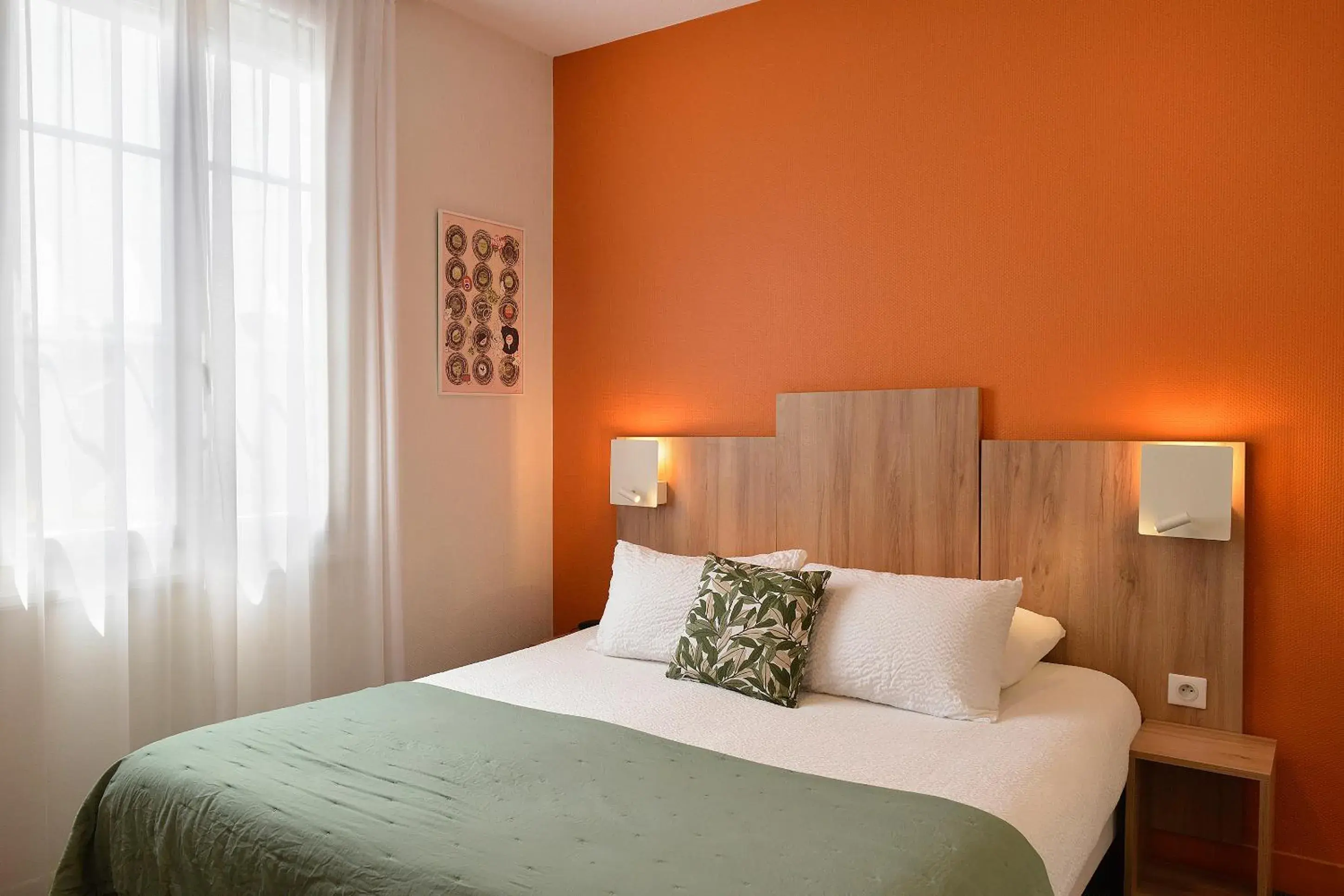 Bed in Logis Hôtel Maison Voltaire Bed in Logis Hôtel Maison Voltaire