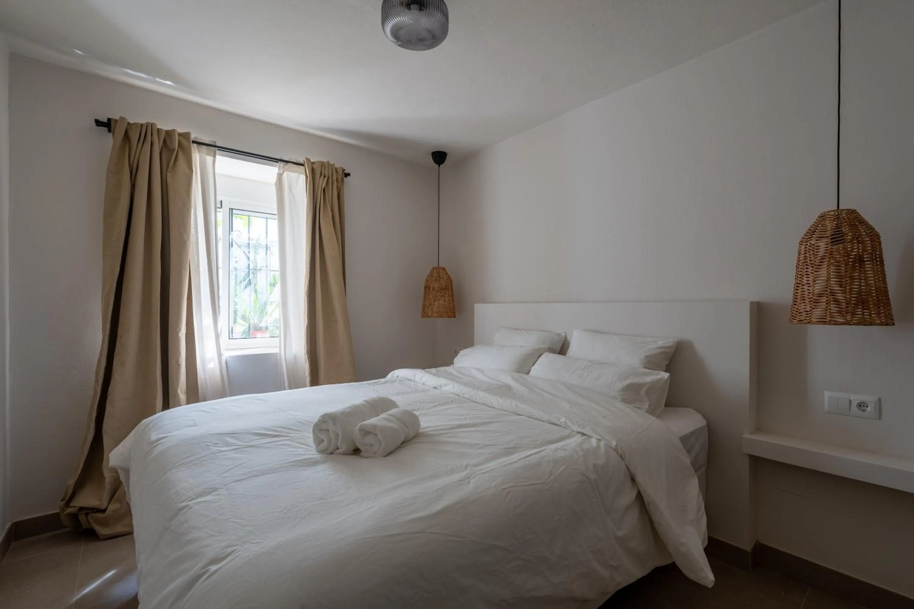 Bed in I AM La Posada Hotel and Apartment