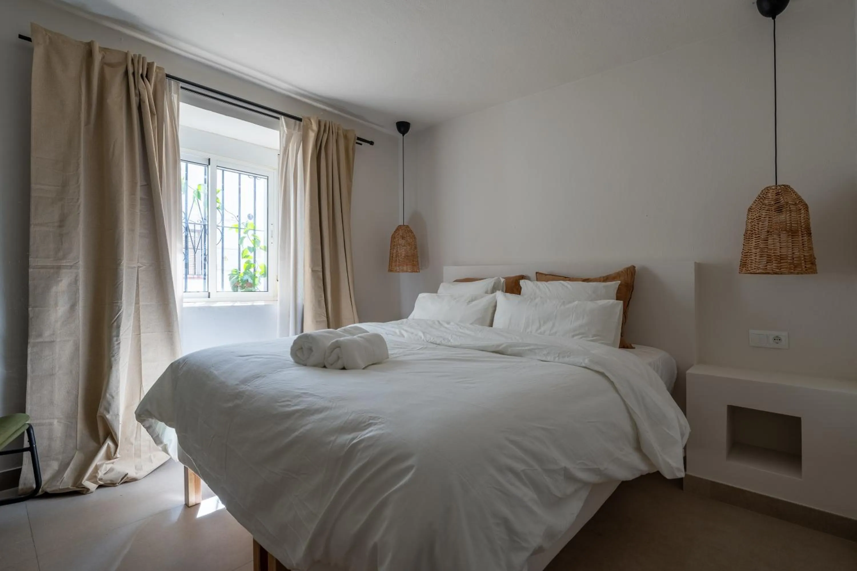 Bed in I AM La Posada Hotel and Apartment