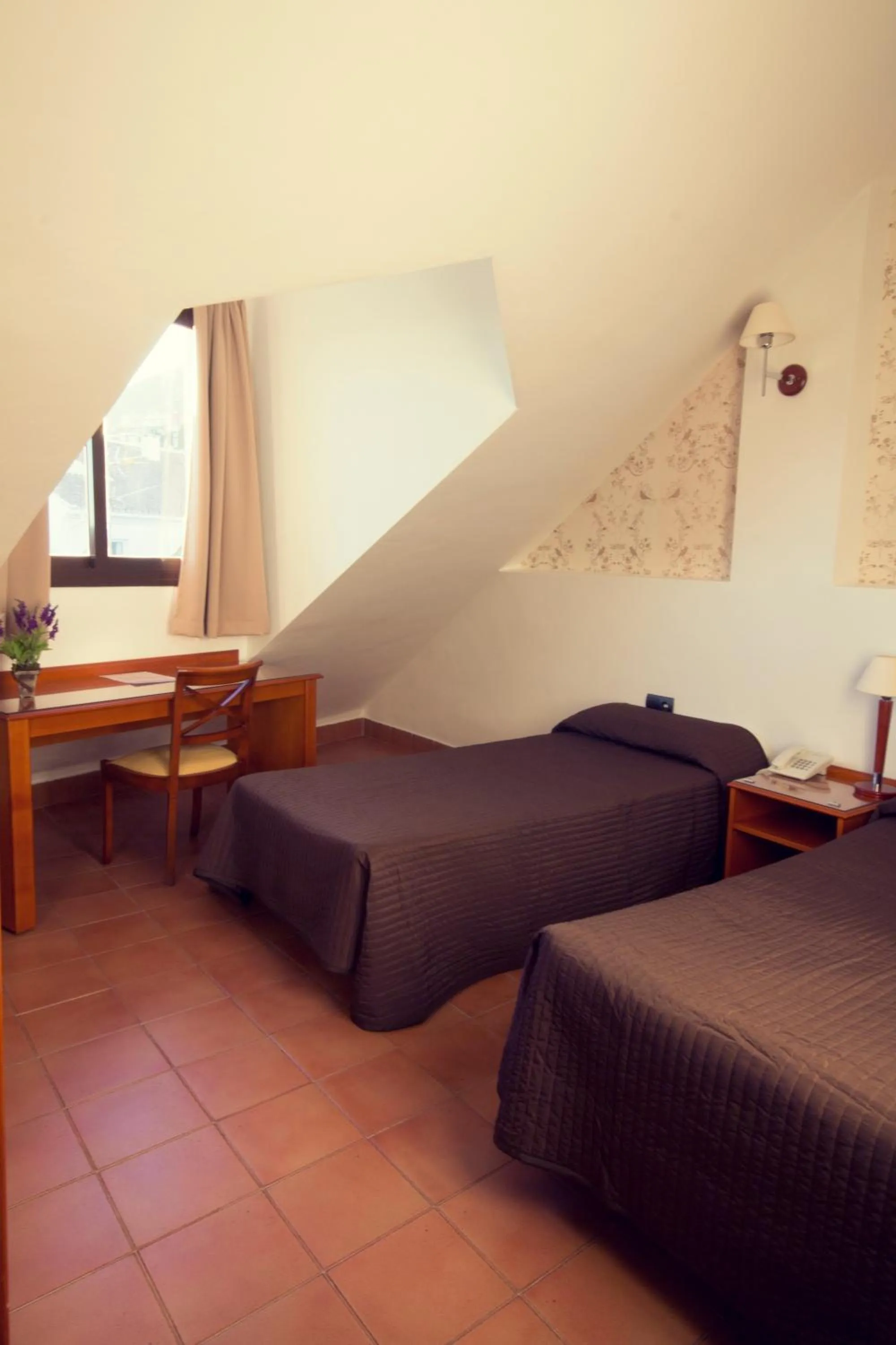 Bed in I AM La Posada Hotel and Apartment