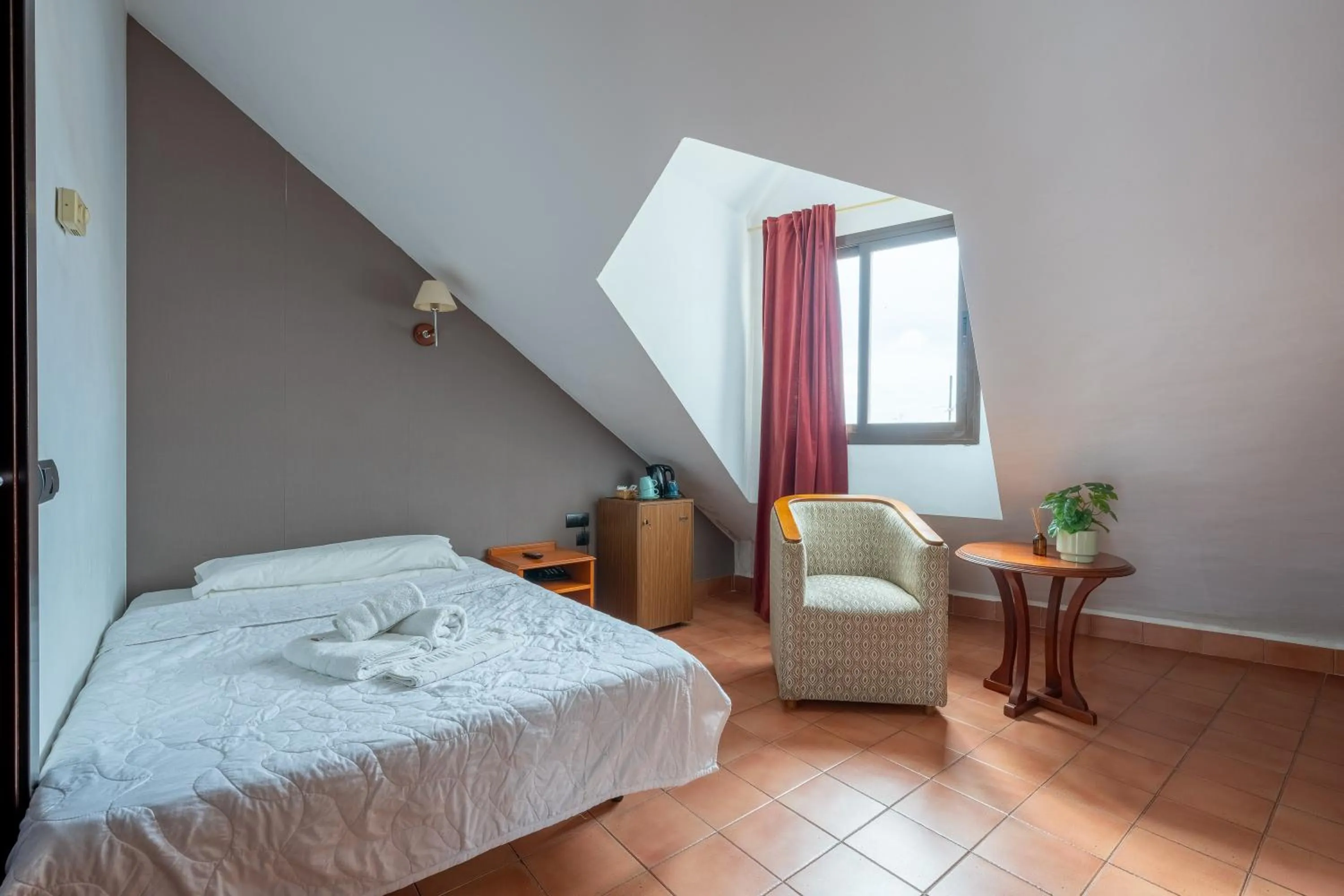 Bed in I AM La Posada Hotel and Apartment