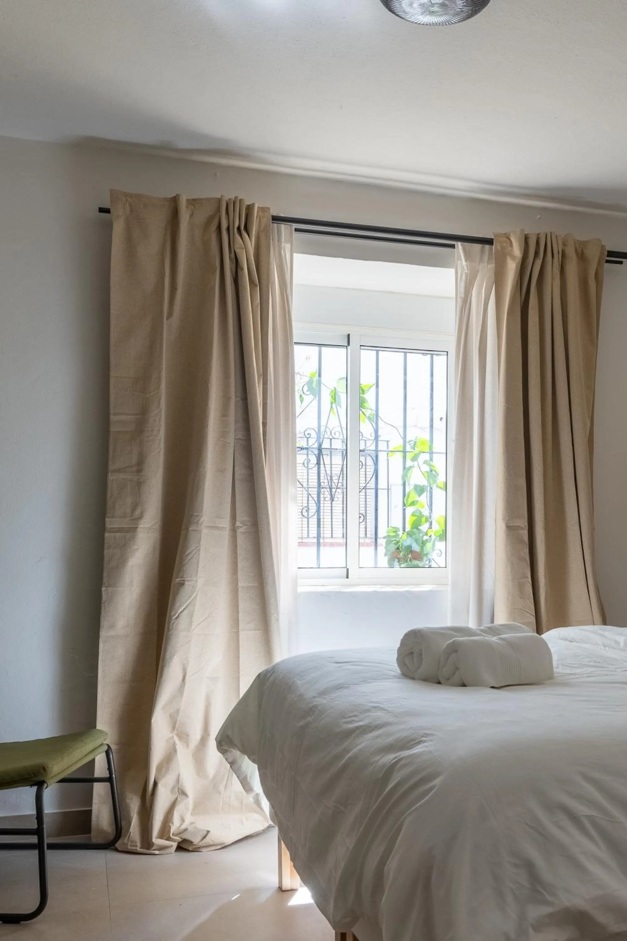 Bed in I AM La Posada Hotel and Apartment