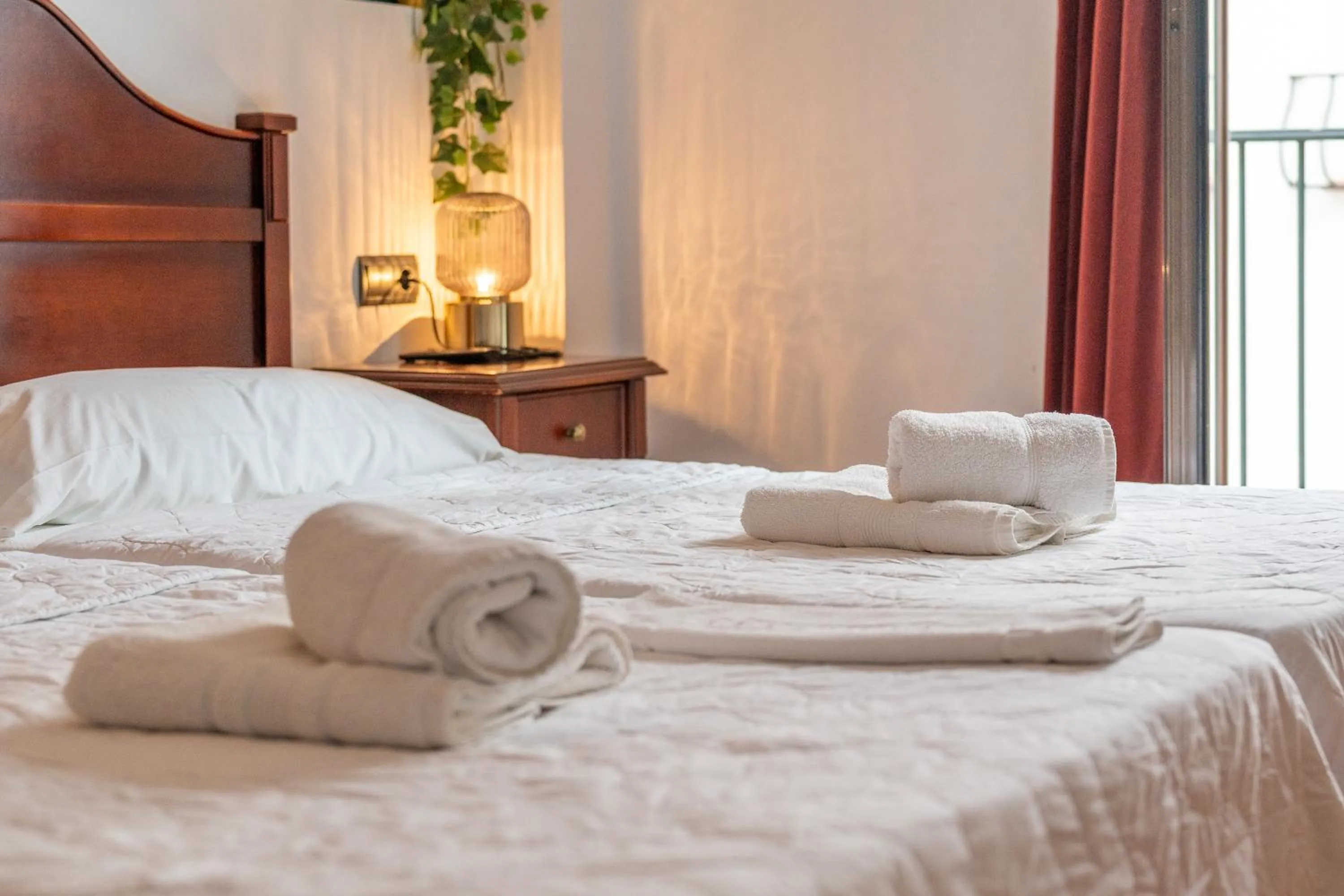 Bed in I AM La Posada Hotel and Apartment