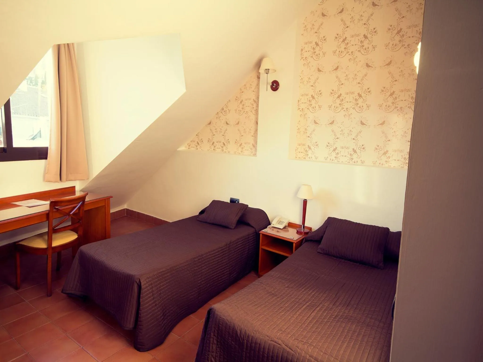 Bed in I AM La Posada Hotel and Apartment