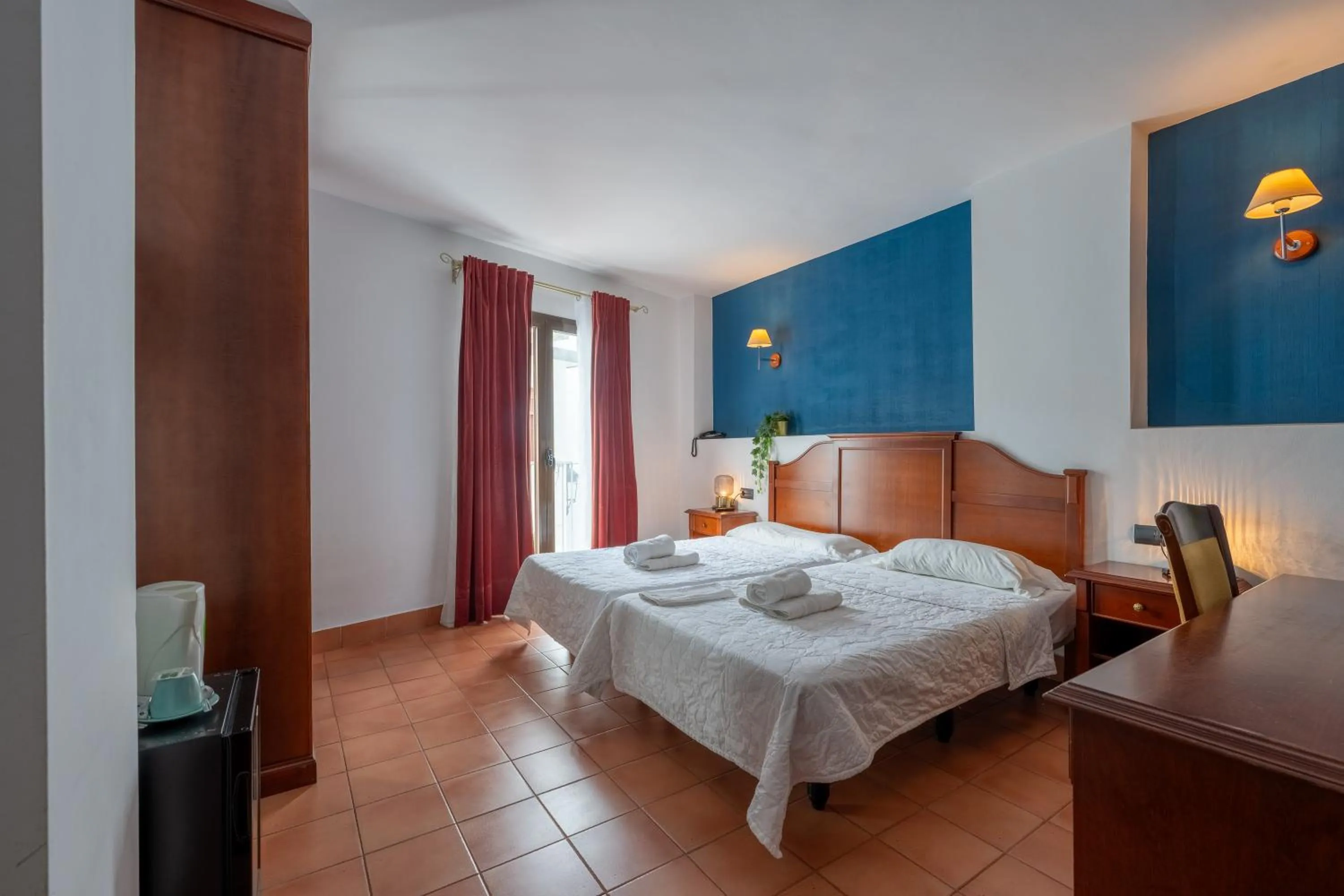 Bed in I AM La Posada Hotel and Apartment