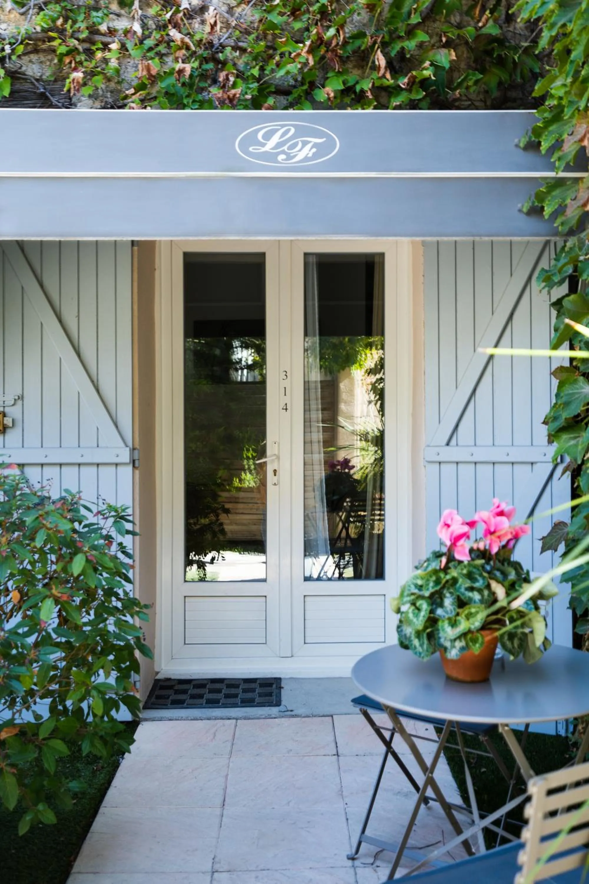 Garden in Logis Hôtel La Fenière