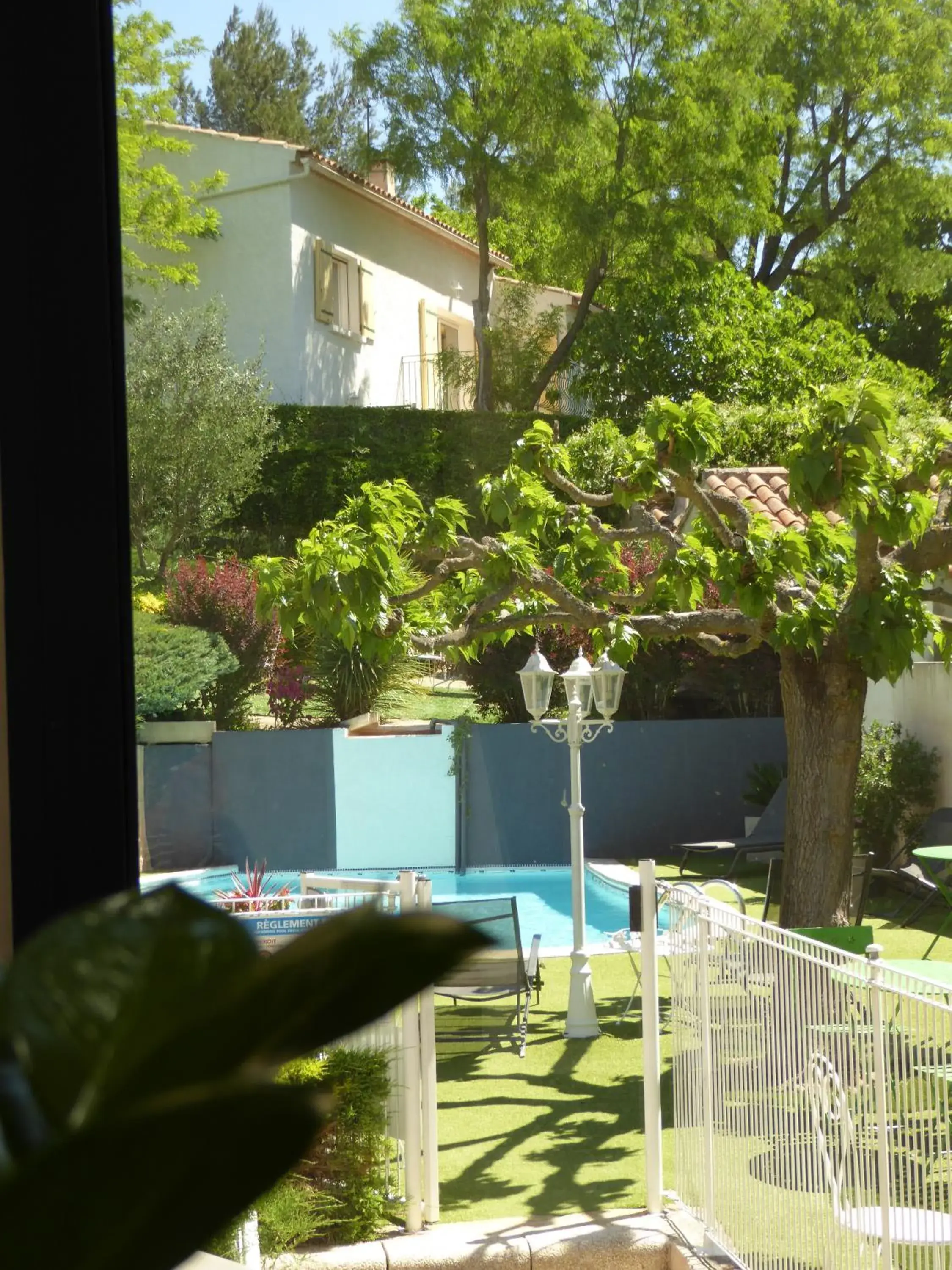 Garden view in Logis Hôtel La Fenière Garden view in Logis Hôtel La Fenière