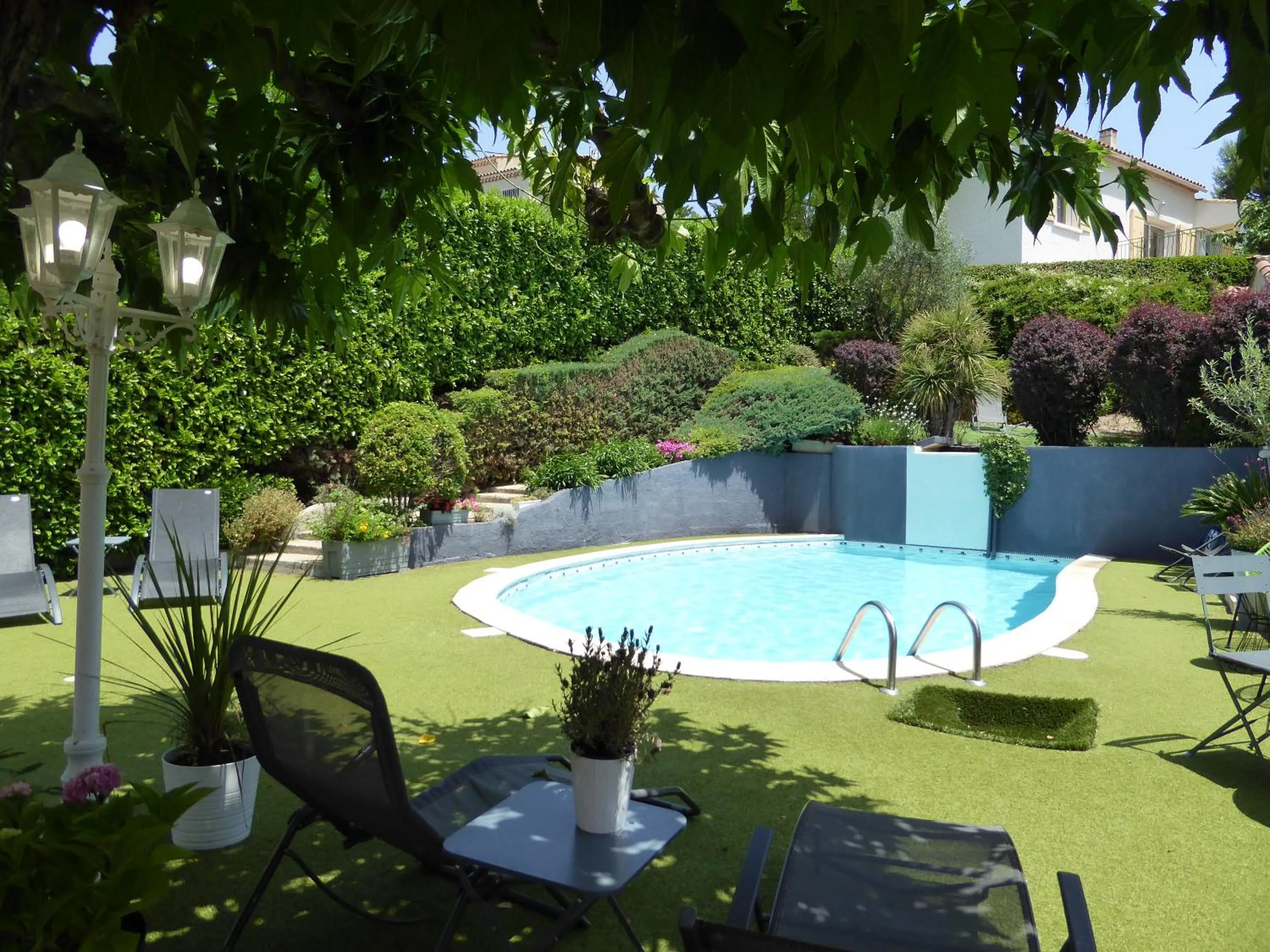 Garden in Logis Hôtel La Fenière