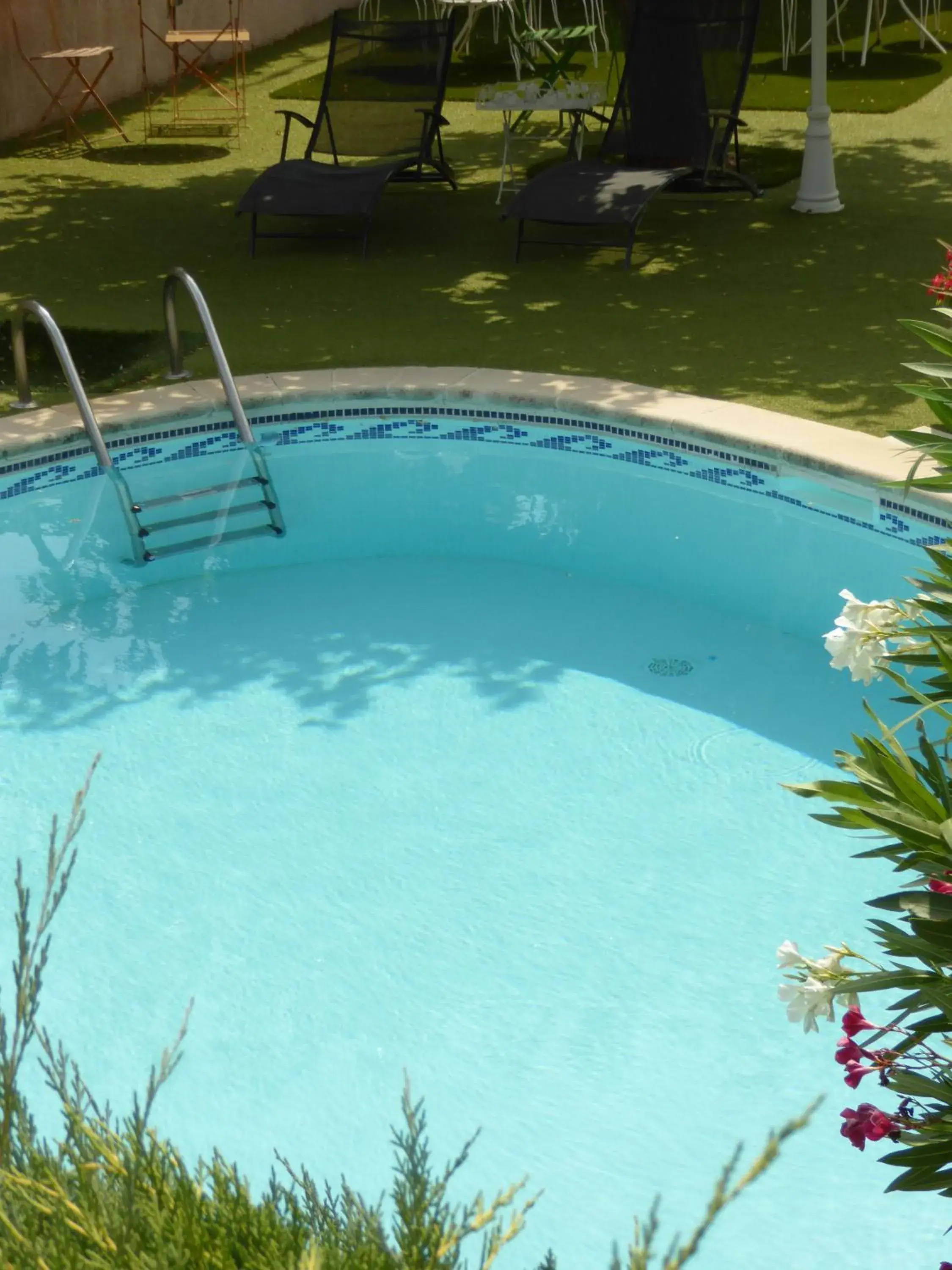 Pool view in Logis Hôtel La Fenière Pool view in Logis Hôtel La Fenière