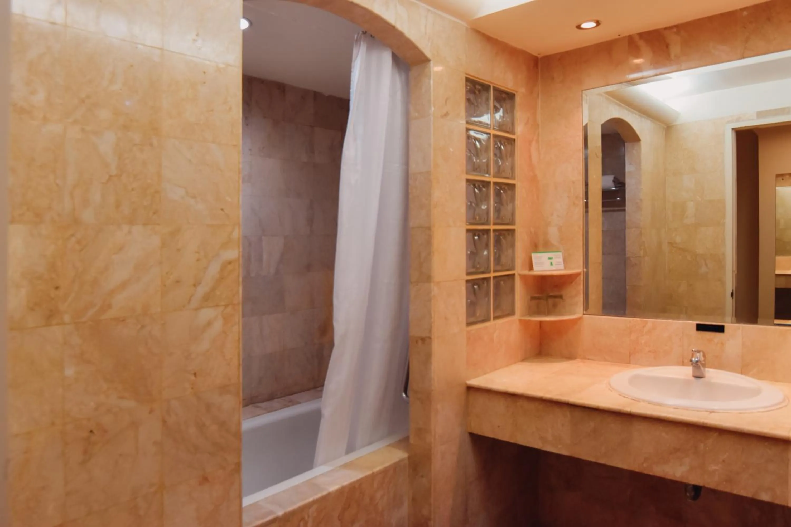 Bathroom in Surabaya Suites Hotel Powered by Archipelago
