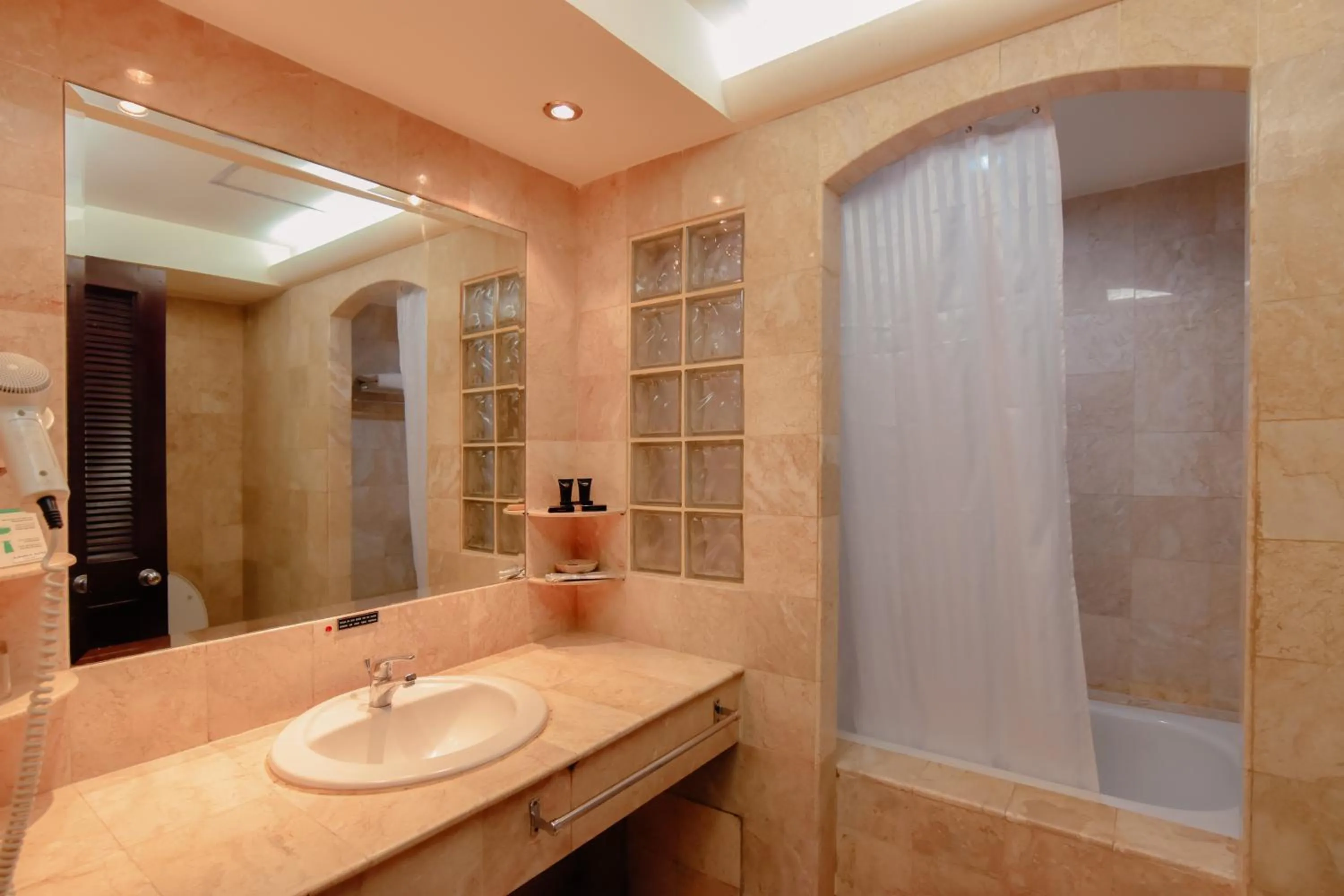 Bathroom in Surabaya Suites Hotel Powered by Archipelago