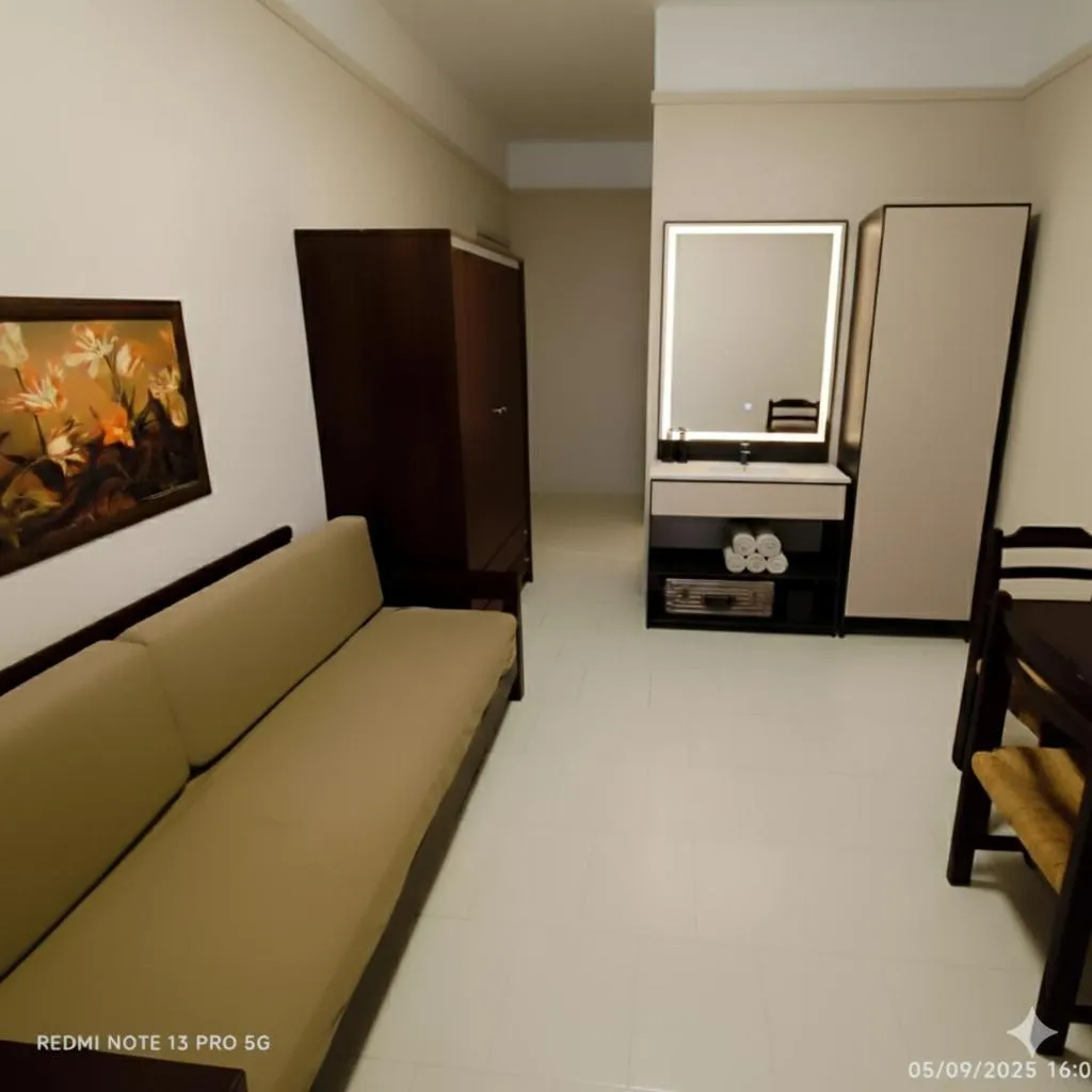 Bed in Talos Hotel Apartments