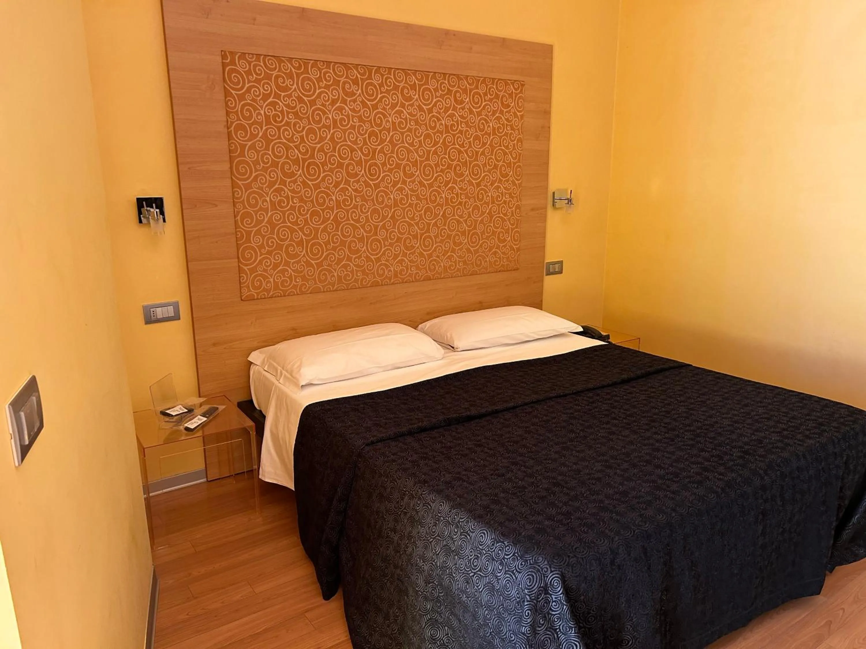 Bed in Hotel Perla - The storyhoteller