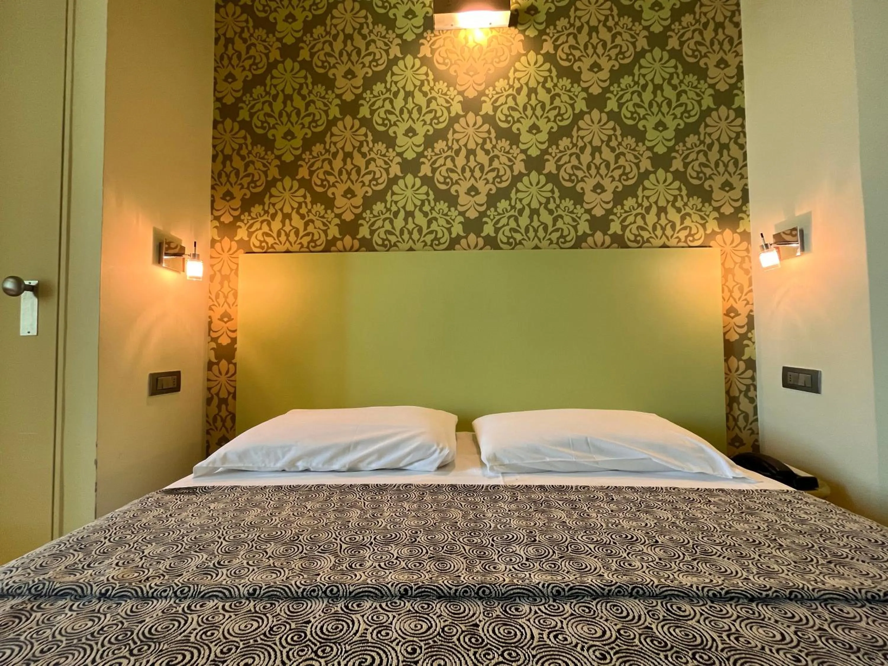 Bed in Hotel Perla - The storyhoteller