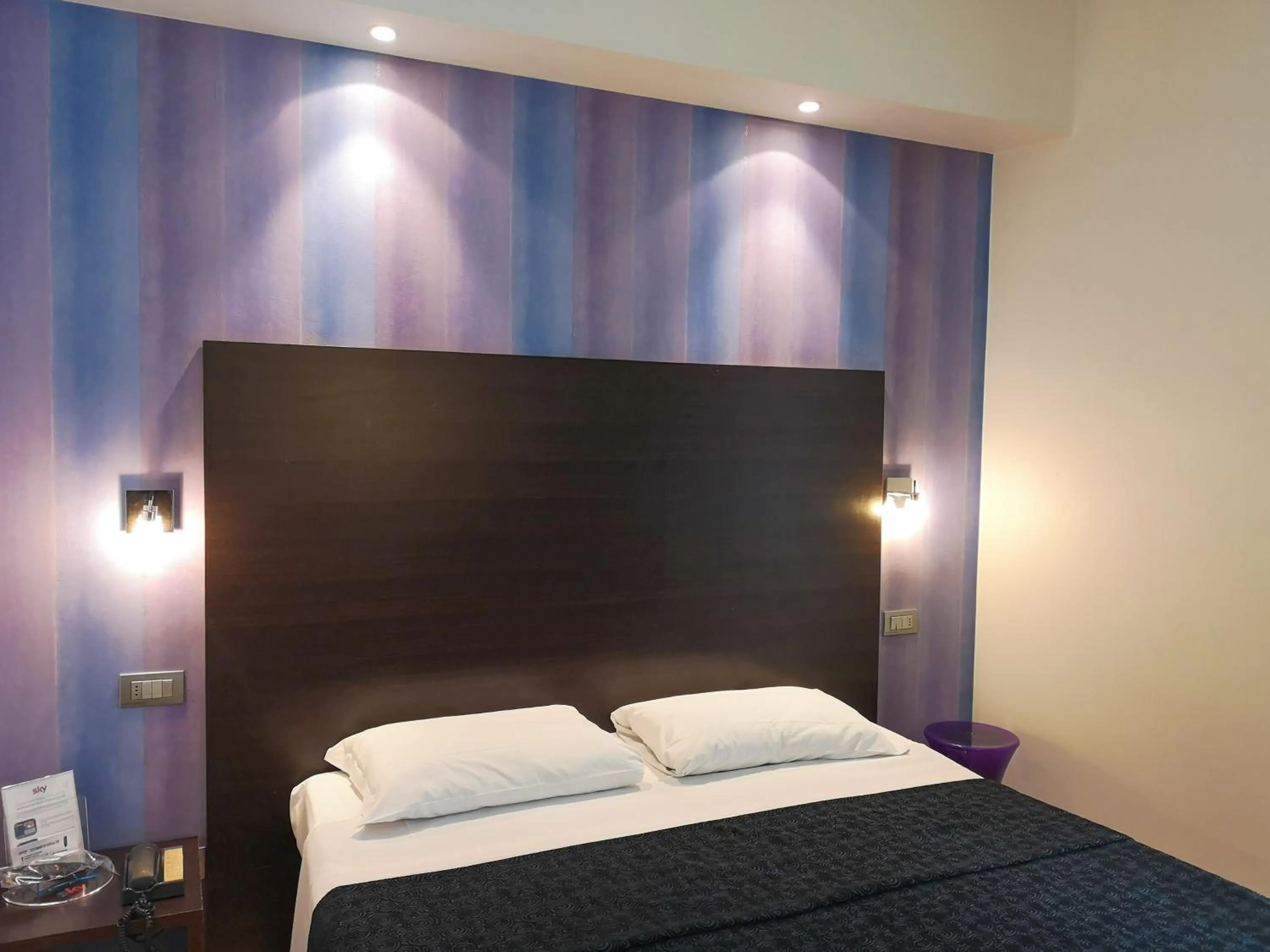 Bed in Hotel Perla - The storyhoteller