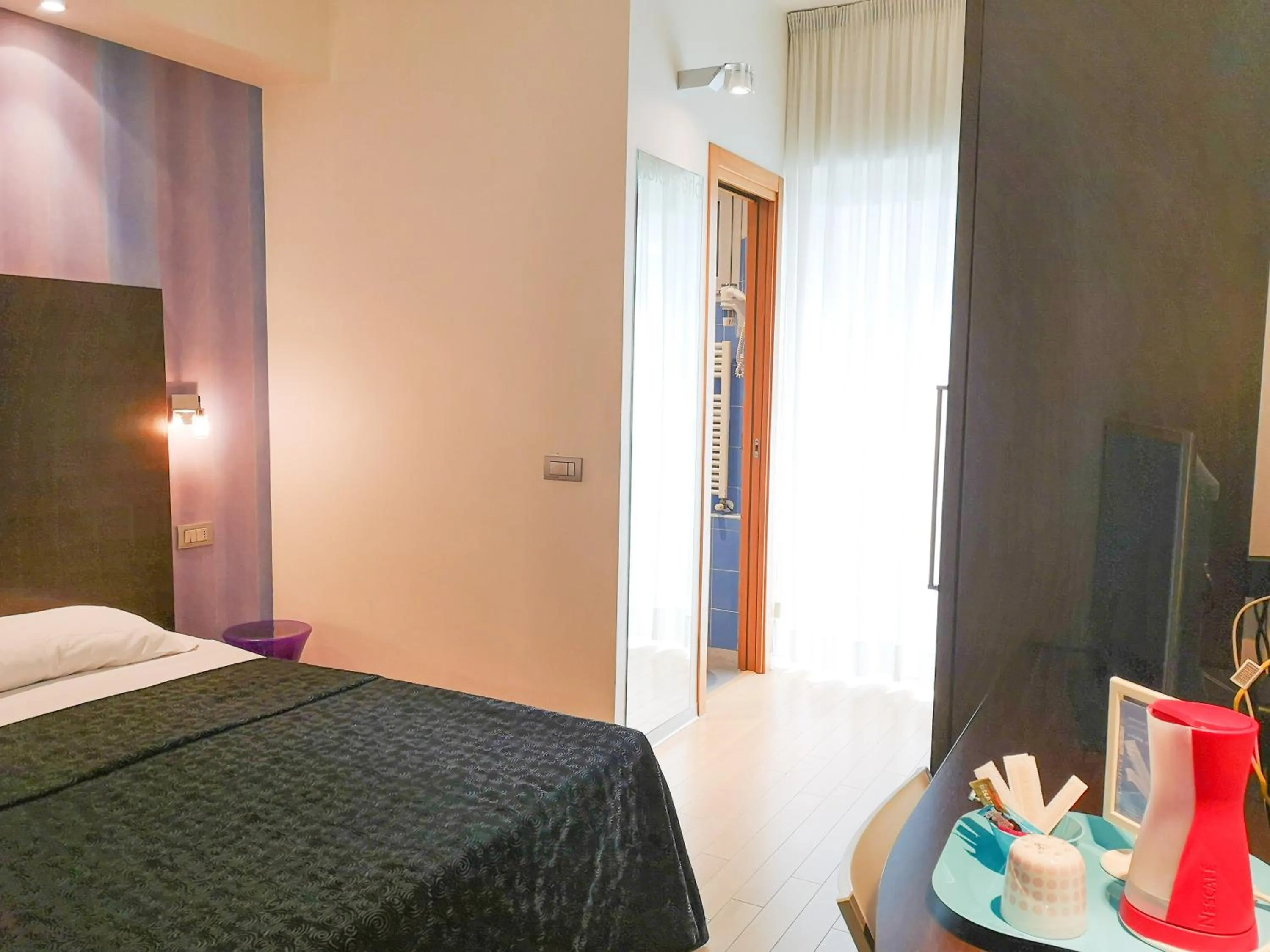 Bed in Hotel Perla - The storyhoteller