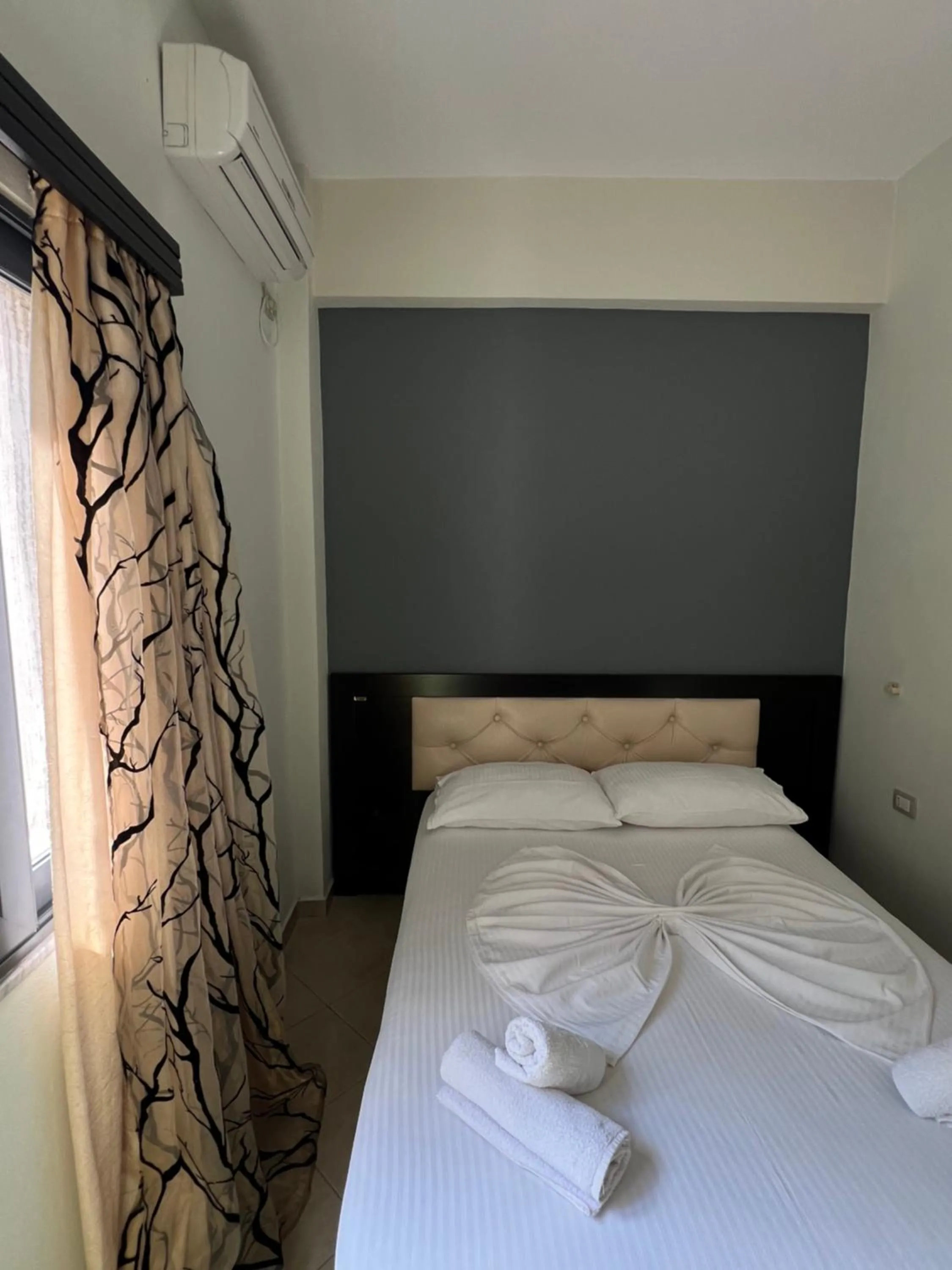 Bed in Privé City Hotel