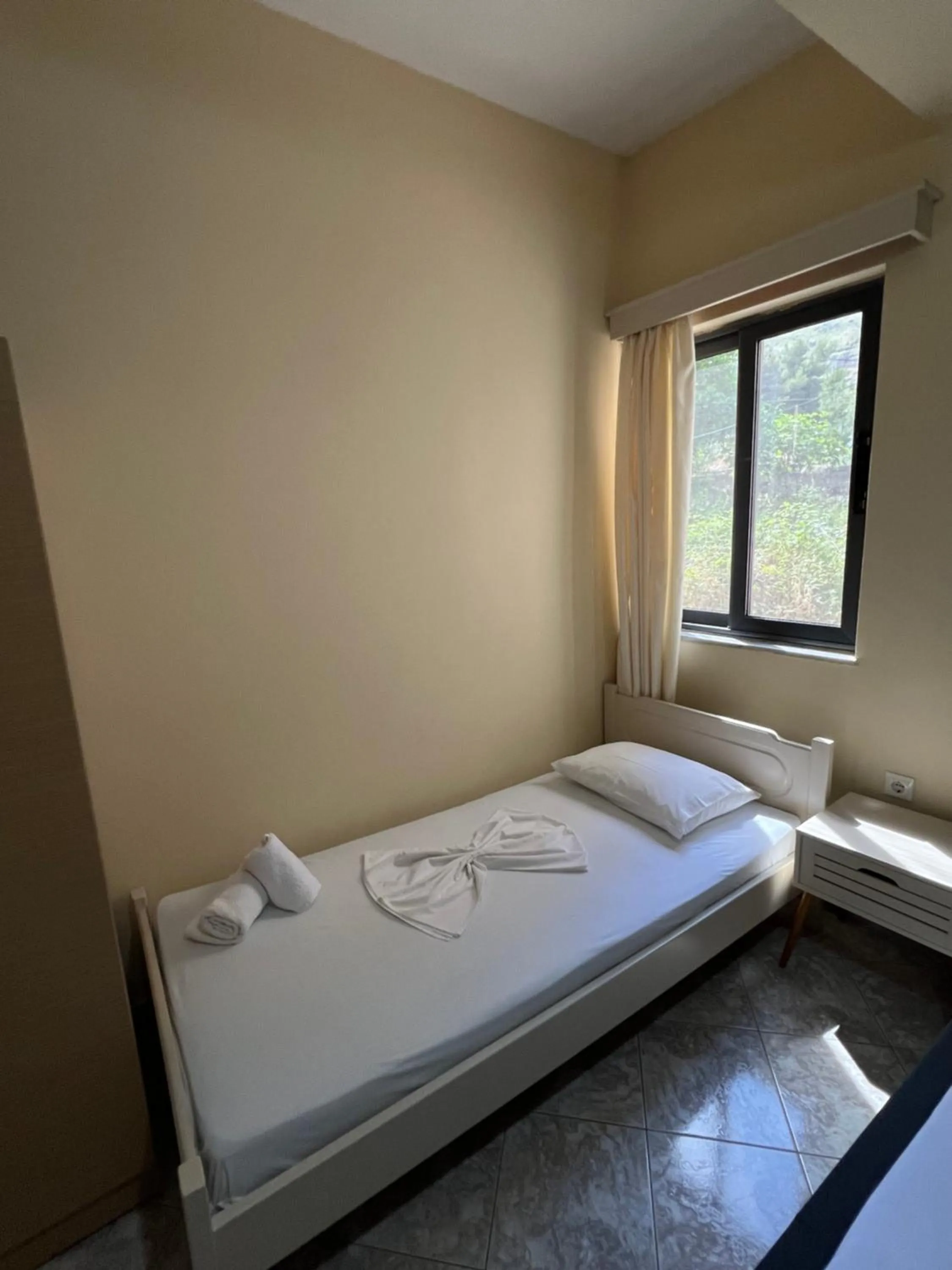Bed in Privé City Hotel