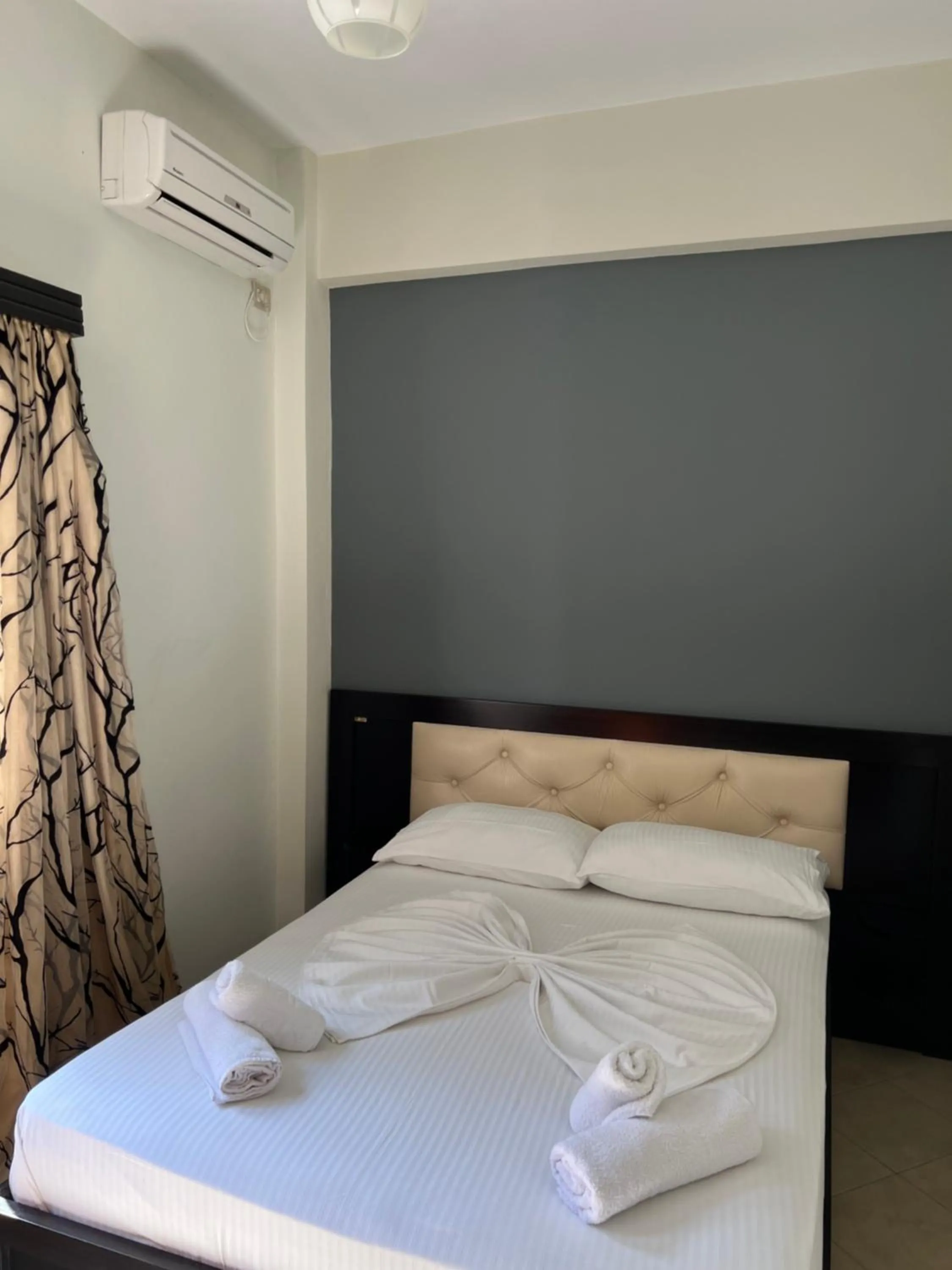 Bed in Privé City Hotel