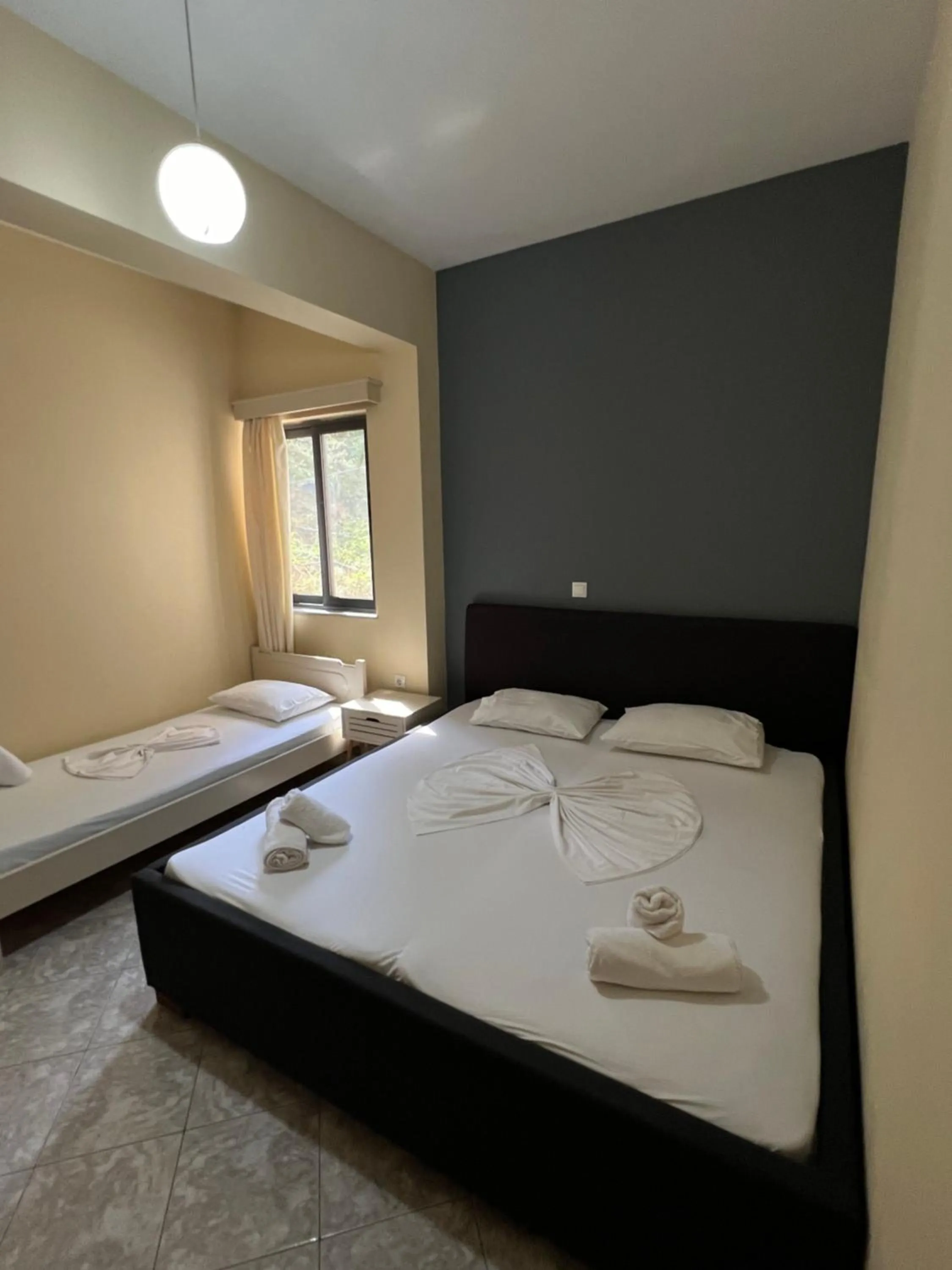 Bed in Privé City Hotel