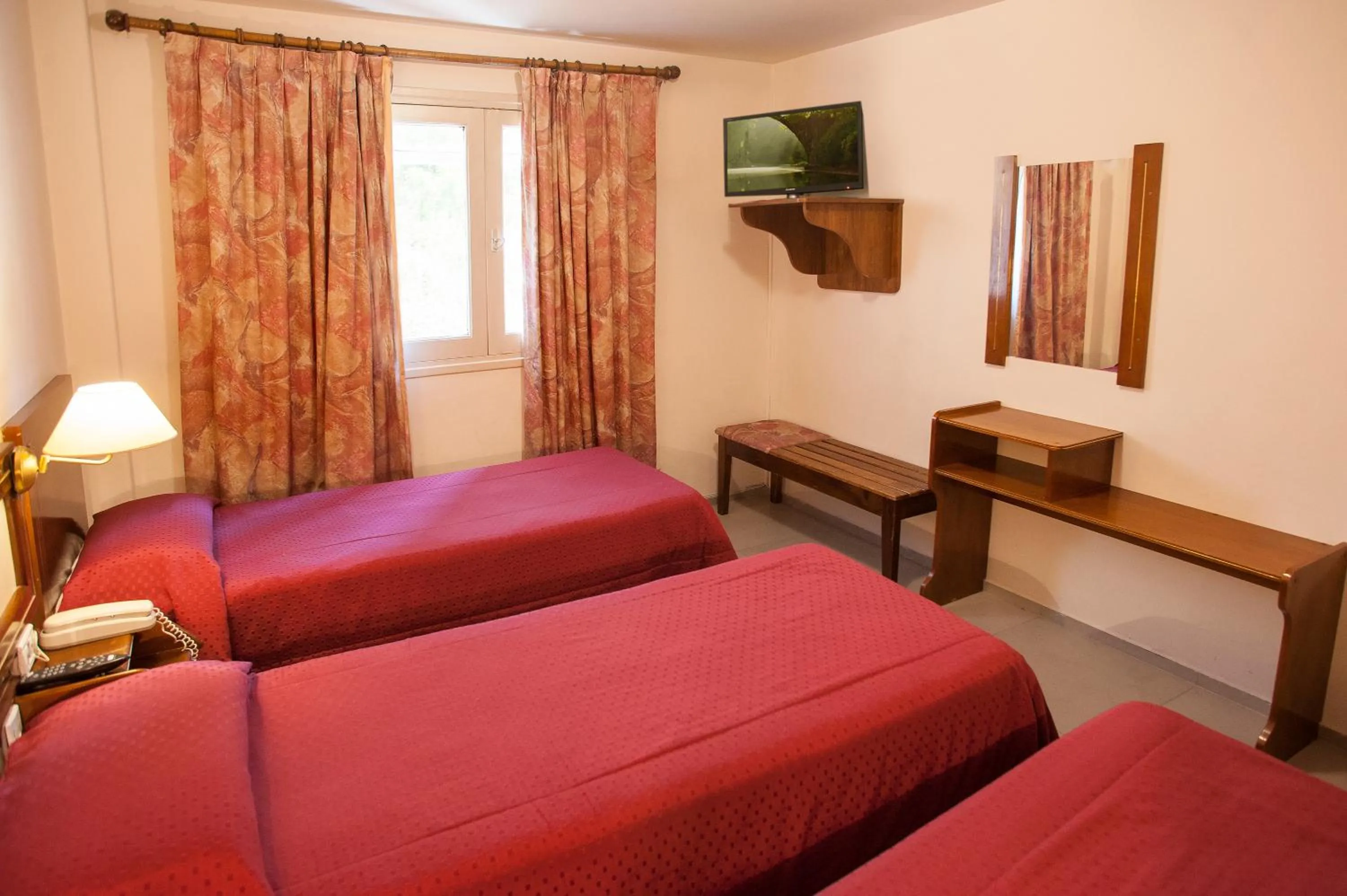 Bed in Hotel Carollo