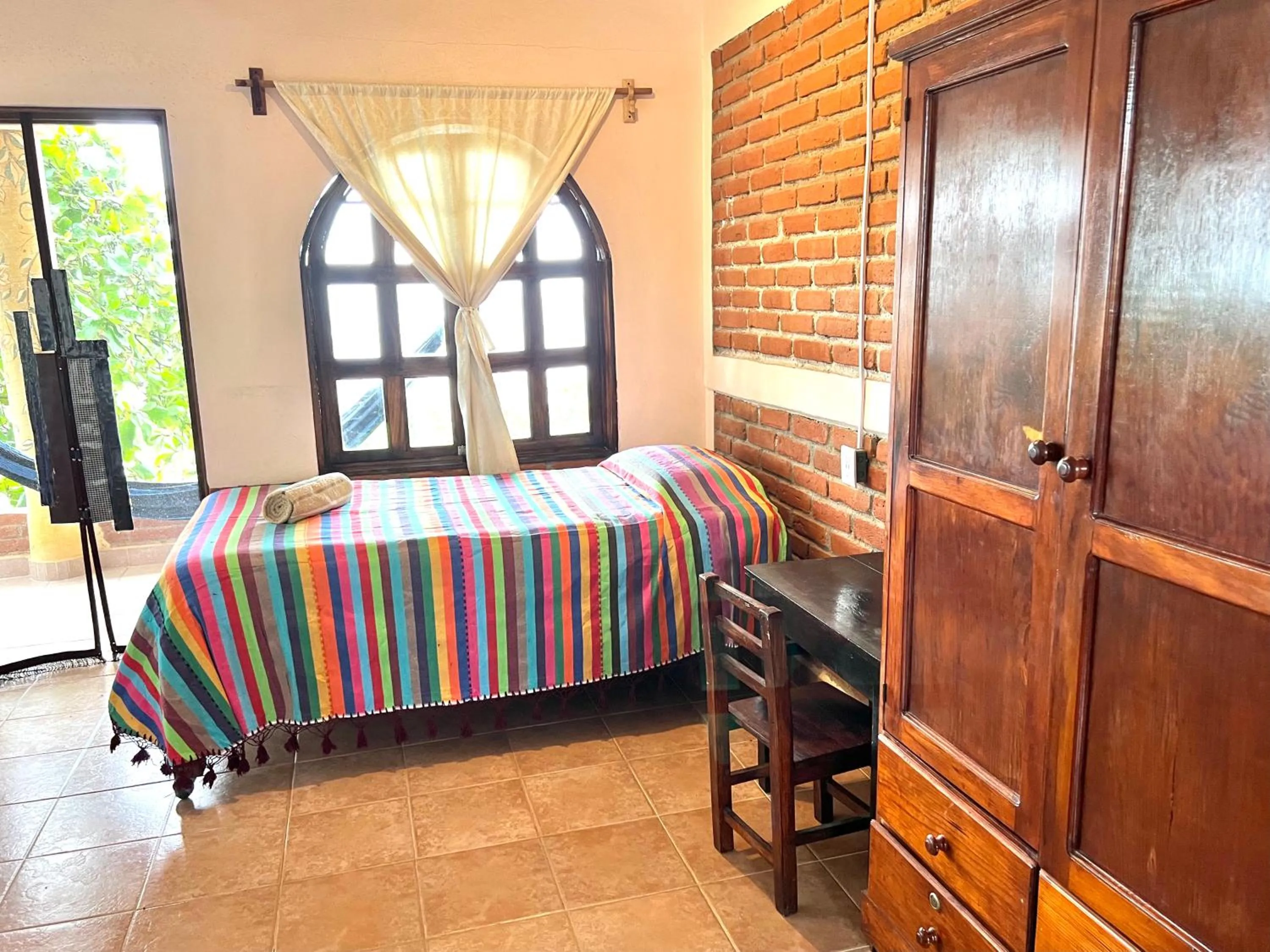 Bed in Ananda Guest House Yoga & Meditación