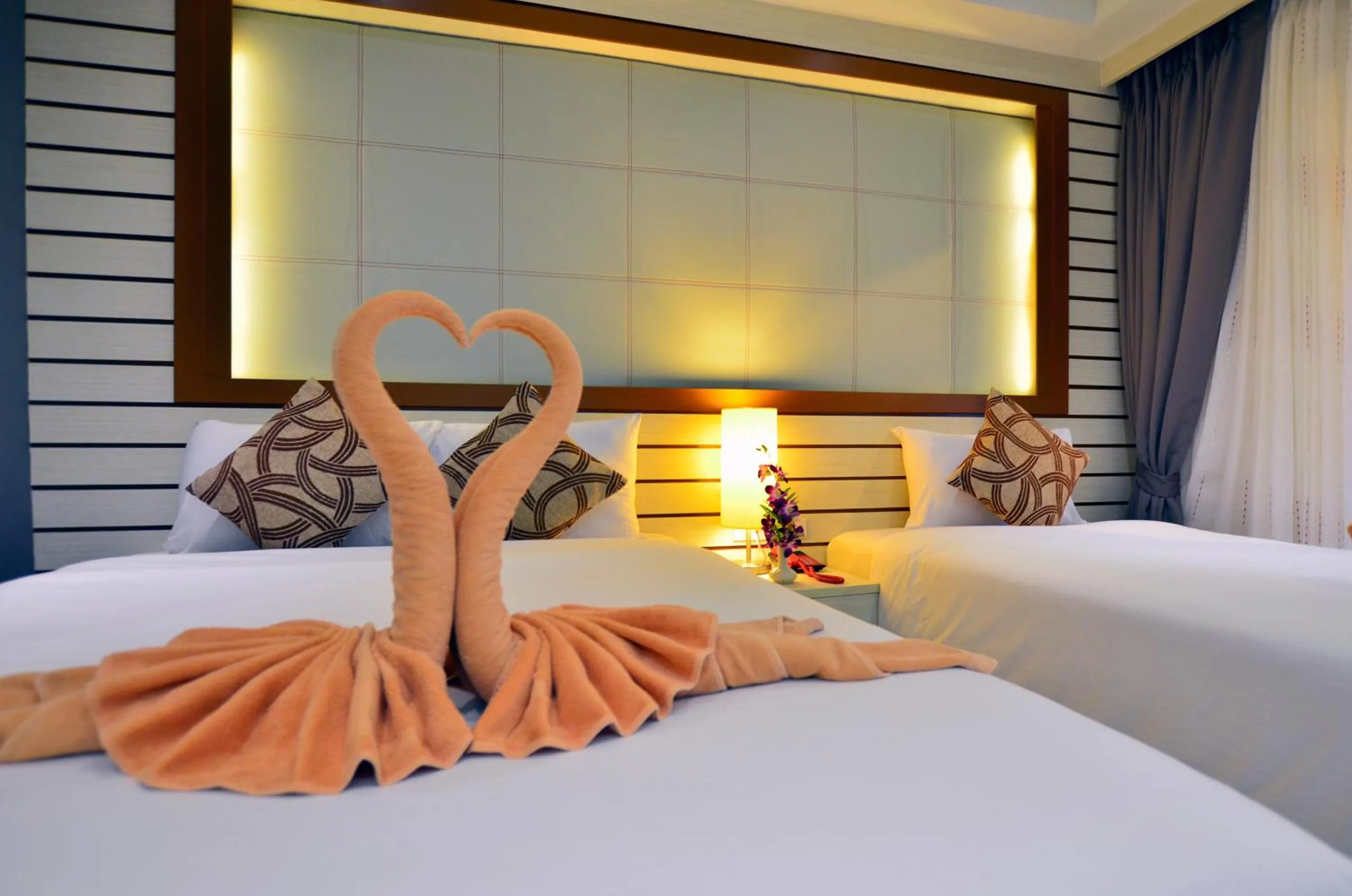 Bed in Windmill Resort Hotel Pattaya