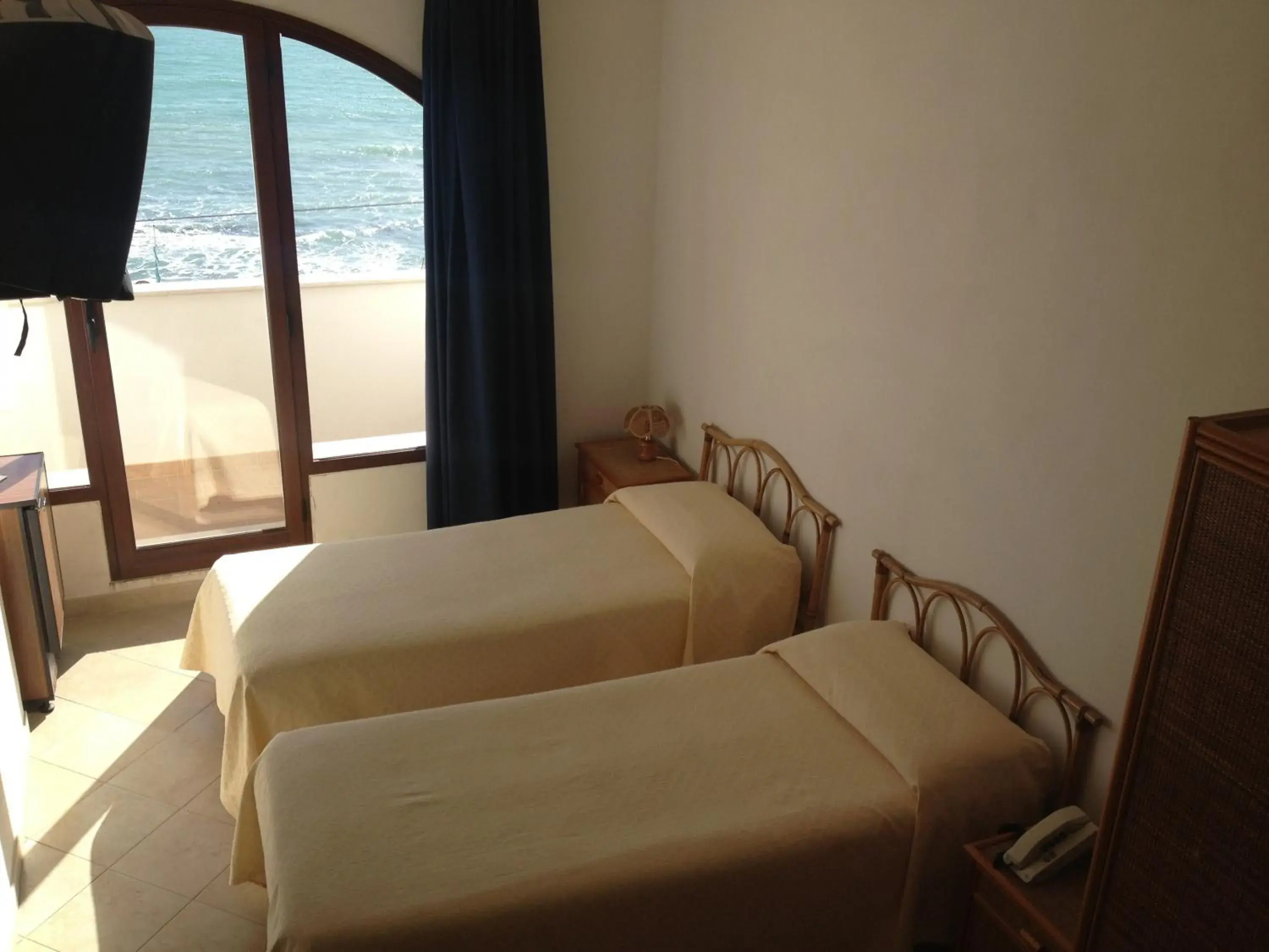 Bed in Hotel Miramare Garzia Bed in Hotel Miramare Garzia