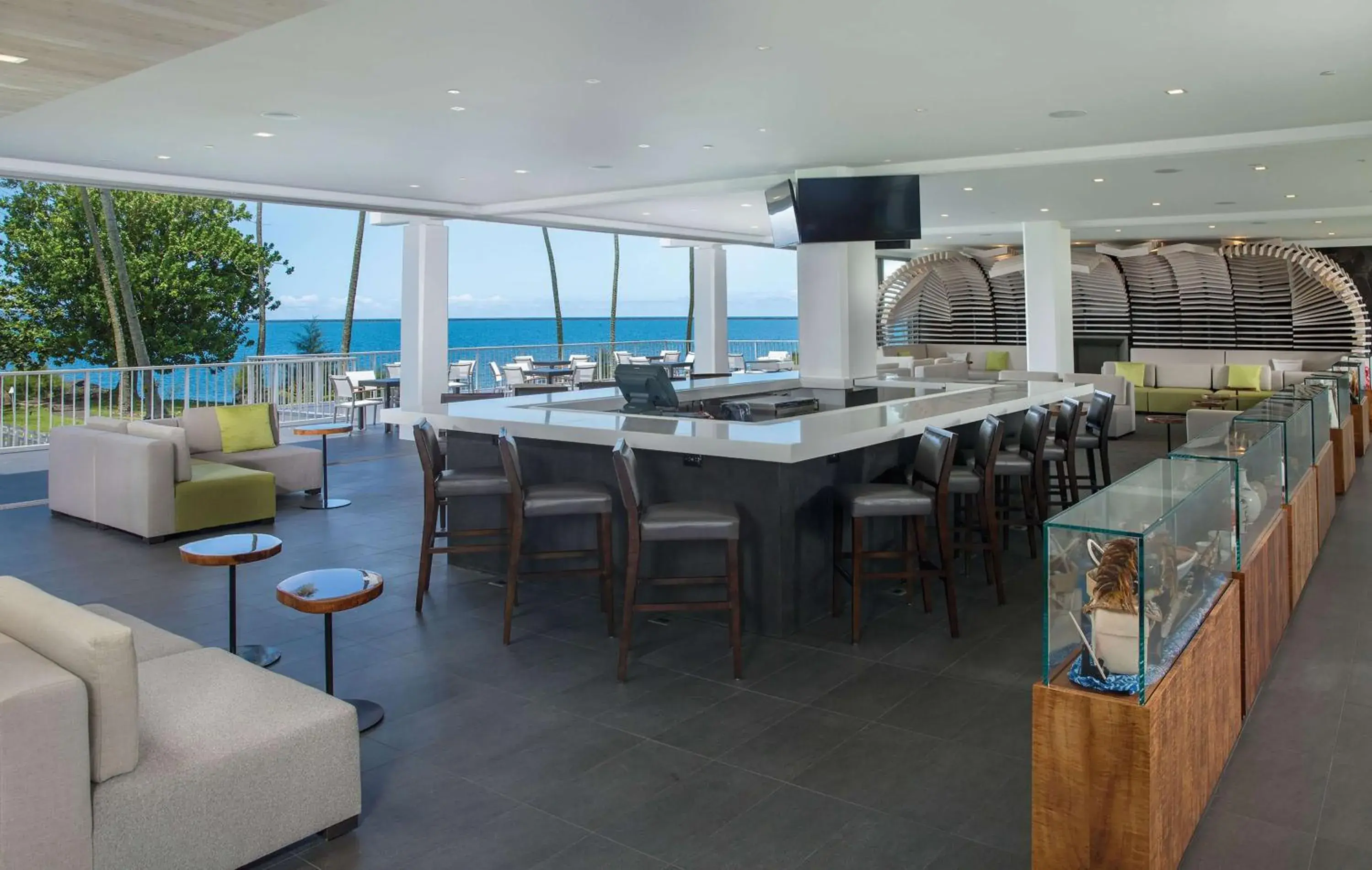 Lounge or bar in Grand Naniloa Hotel, a Doubletree by Hilton Lounge or bar in Grand Naniloa Hotel, a Doubletree by Hilton