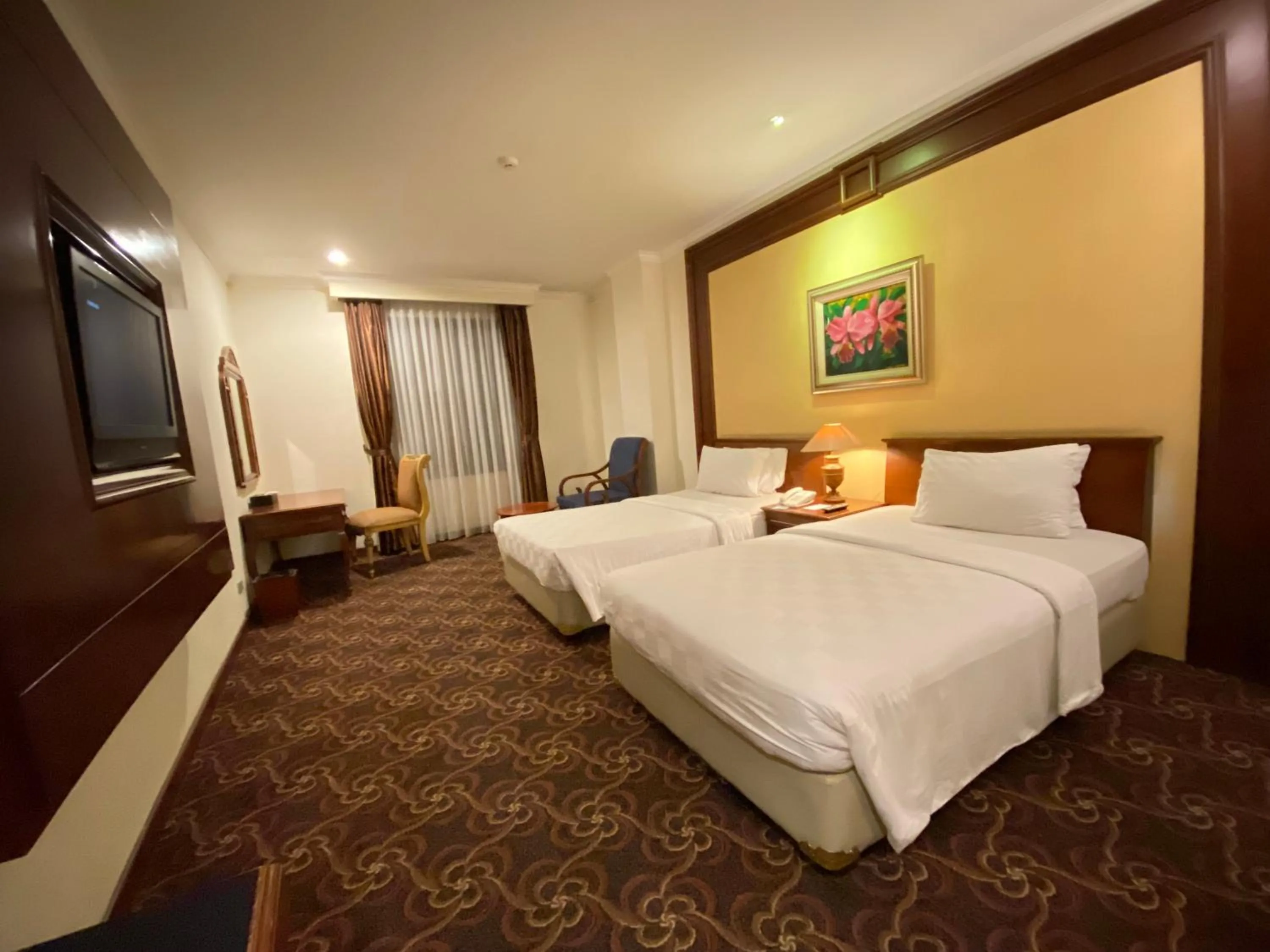 Bed in Arion Suites Hotel