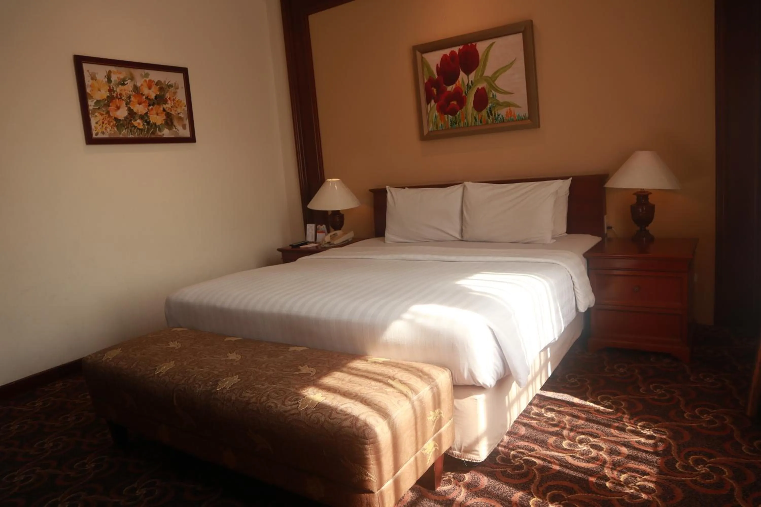 Bed in Arion Suites Hotel