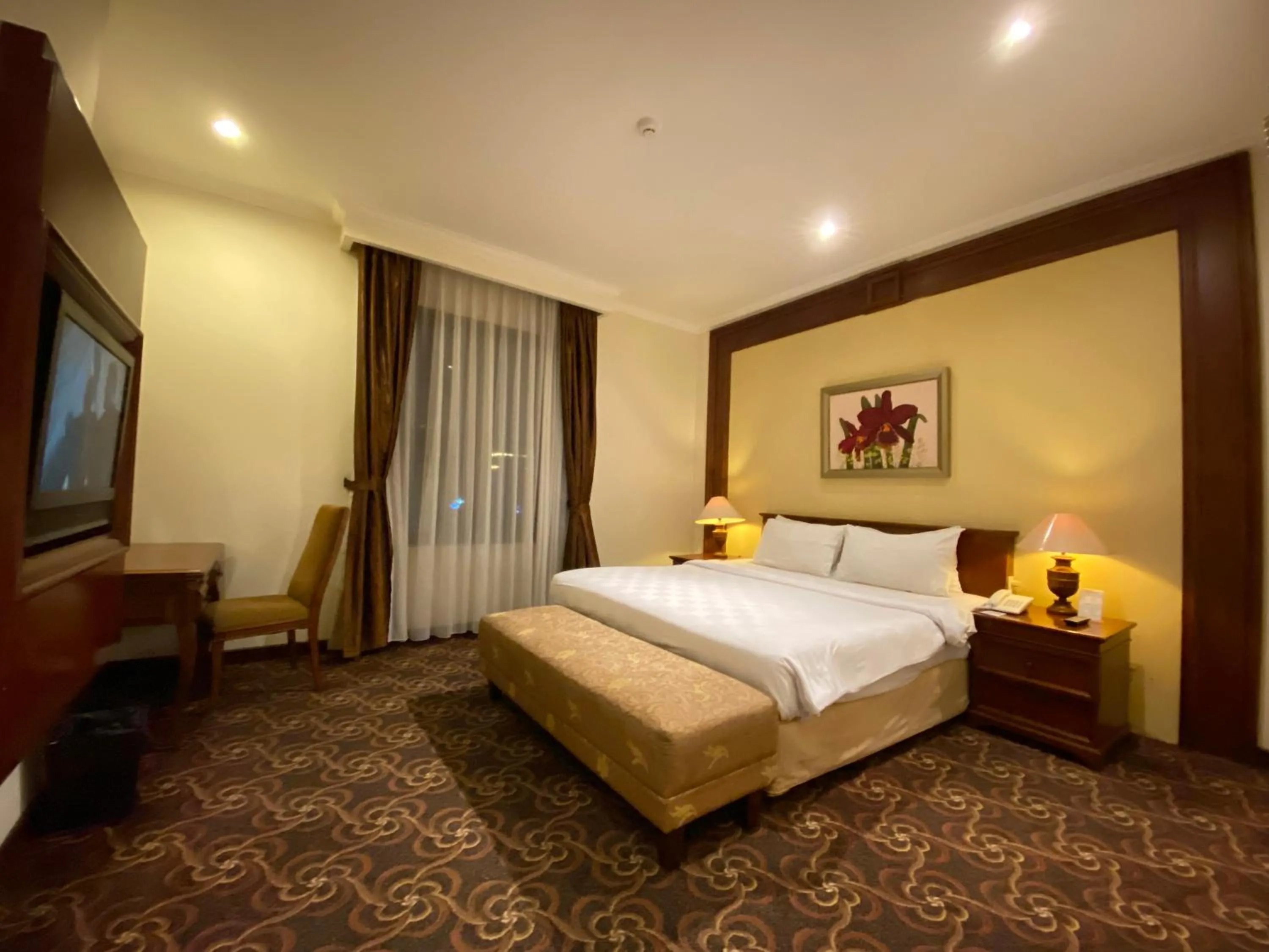 Bed in Arion Suites Hotel