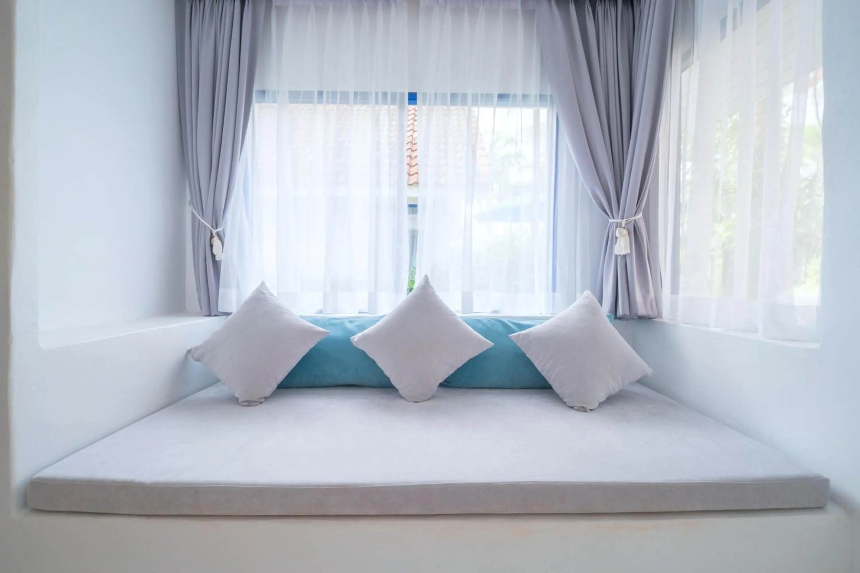 Bed in Ocean Breeze Resort Khaolak