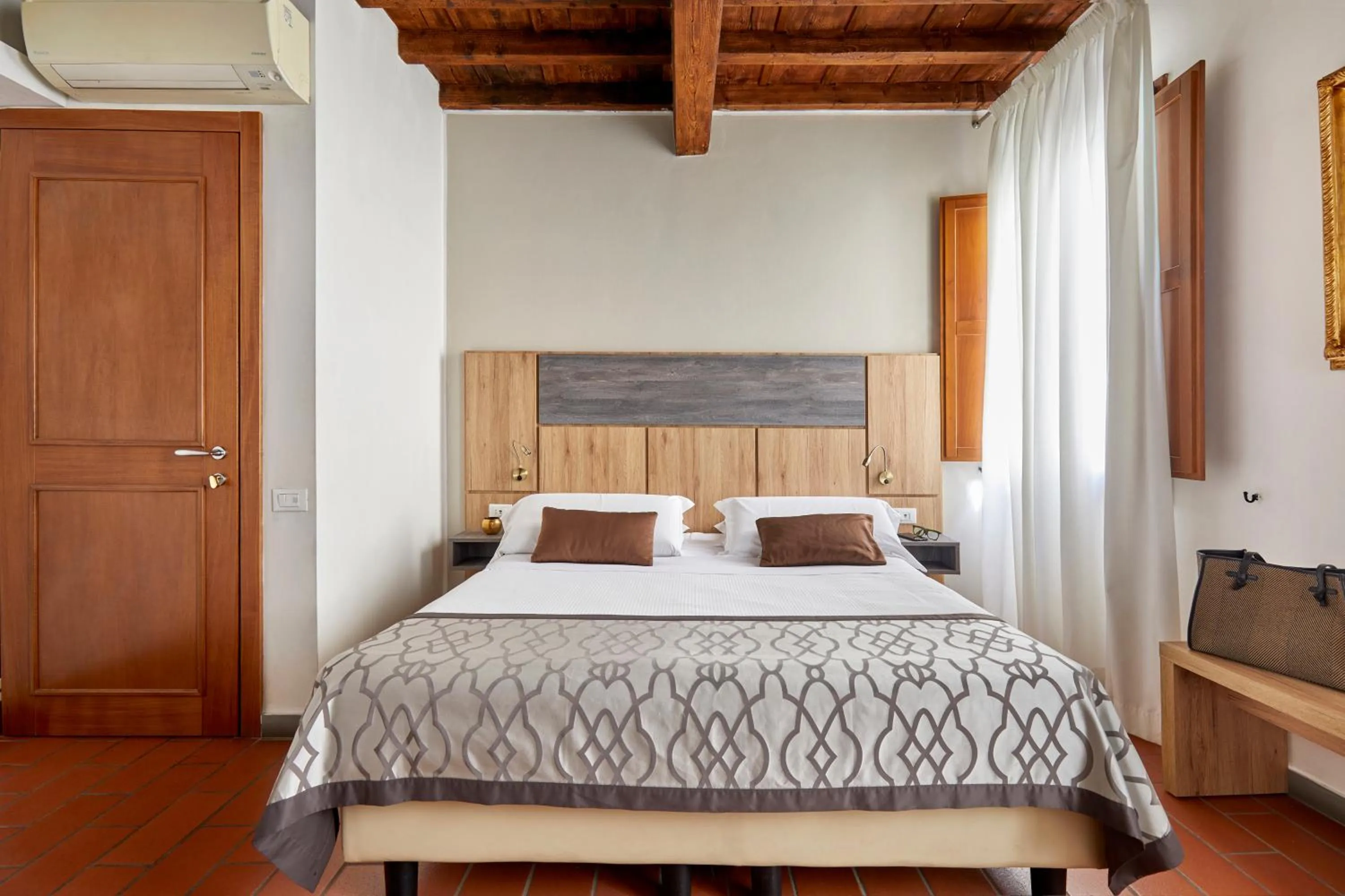 Bed in Sette Angeli Rooms