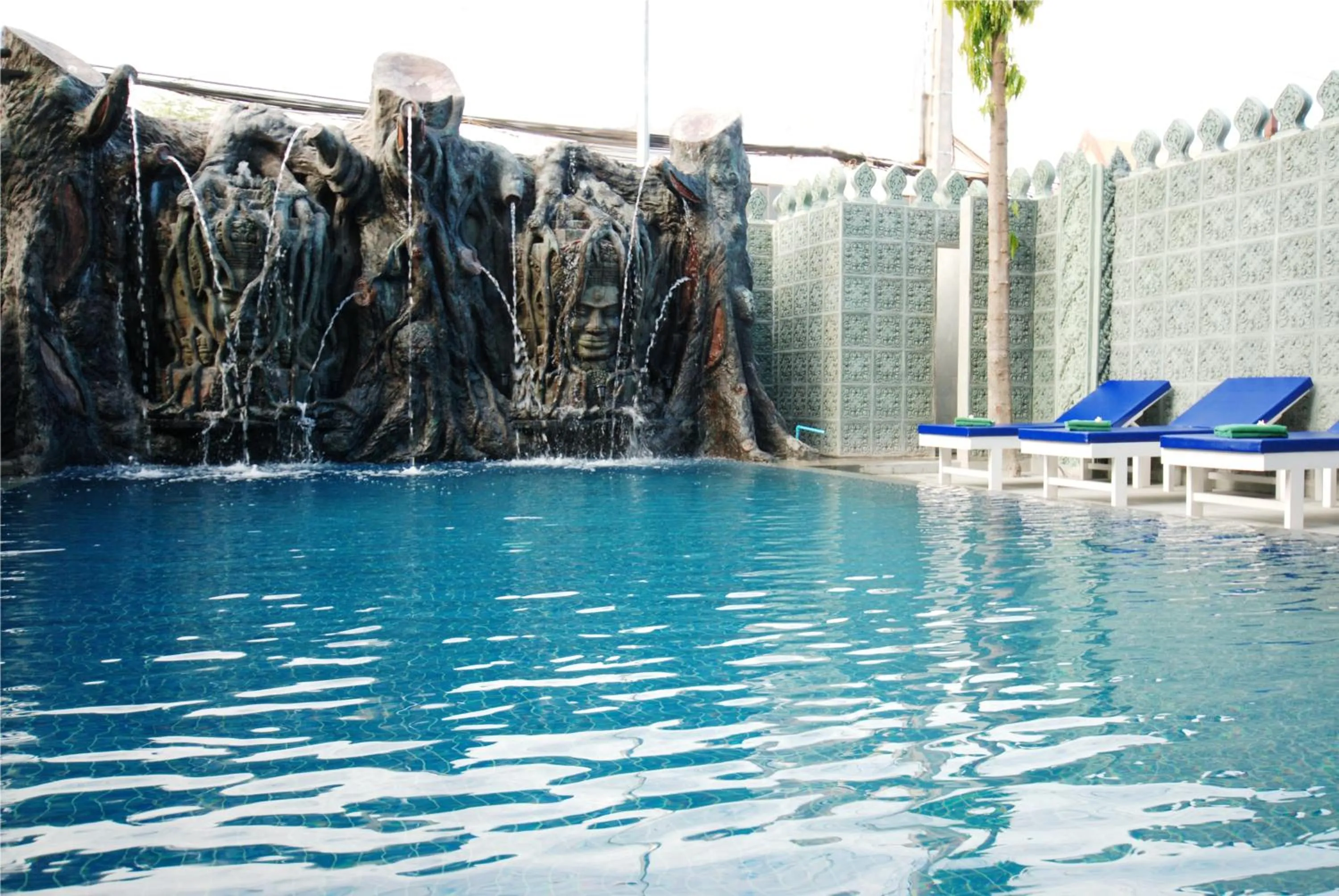 Swimming pool in The Suite By Royal Crown Hotel