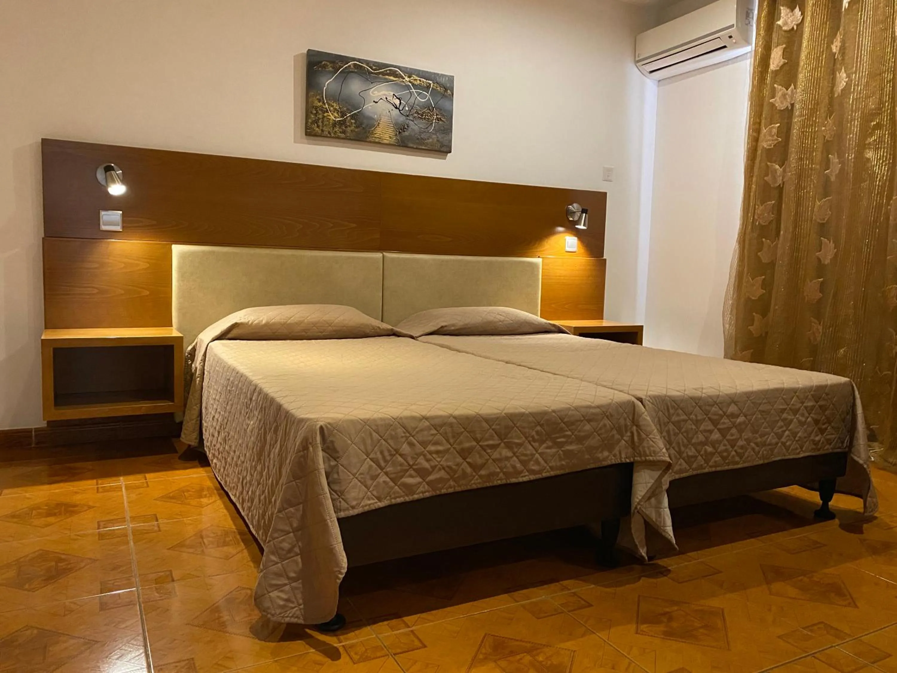 Bed in Alexia Hotel Apartments