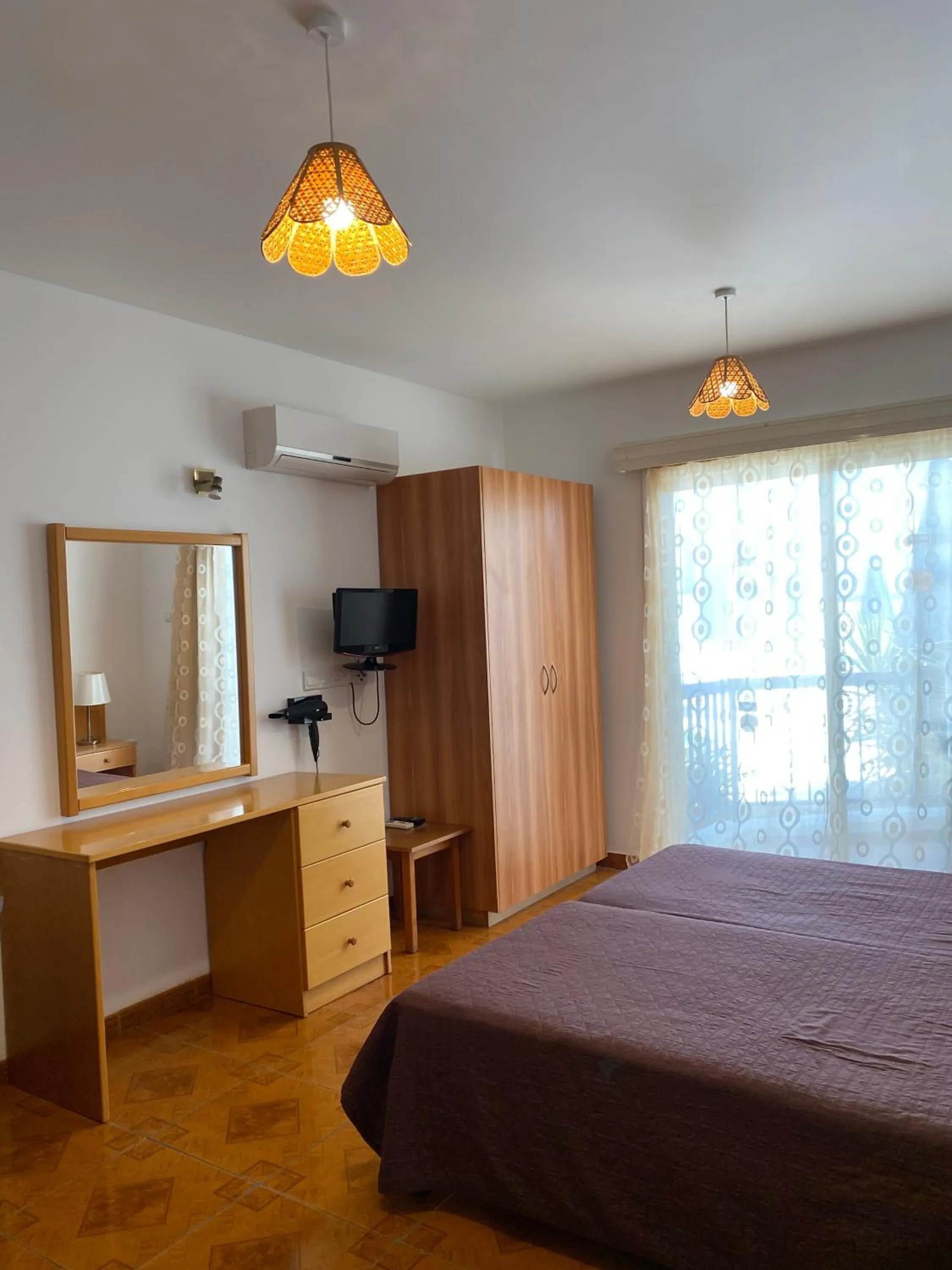 Bed in Alexia Hotel Apartments