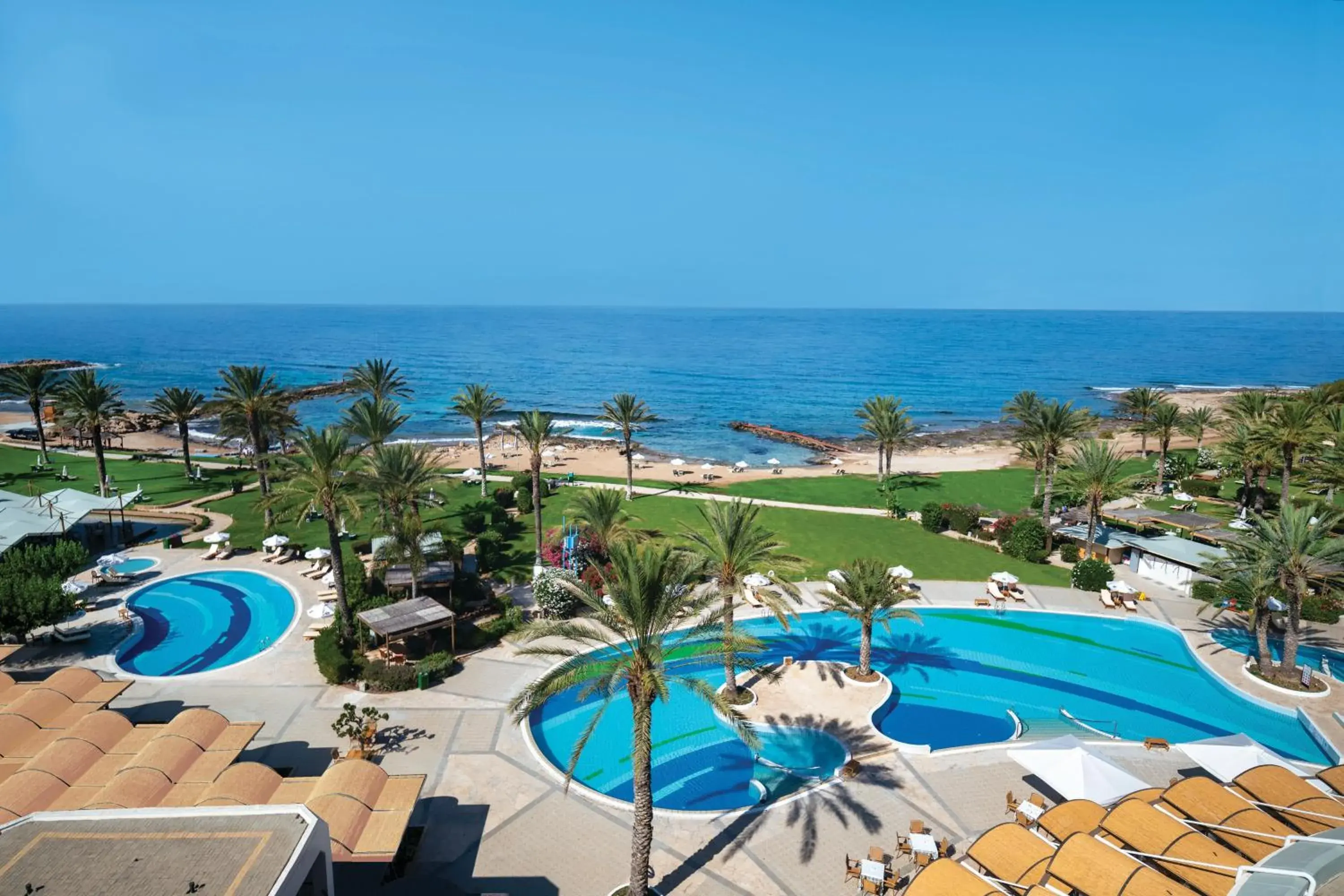 Pool view in Constantinou Bros Athena Beach Hotel Pool view in Constantinou Bros Athena Beach Hotel