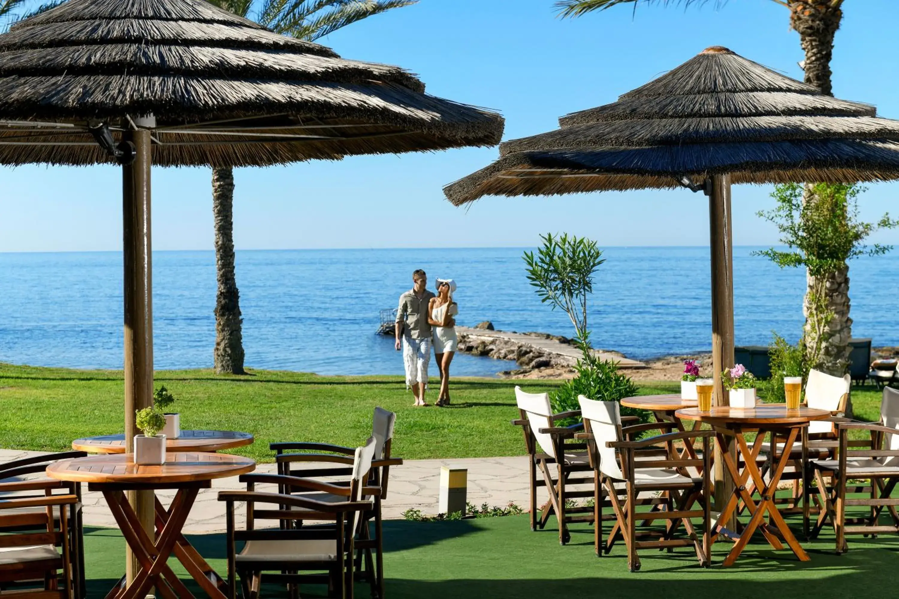 Lounge or bar in Constantinou Bros Athena Beach Hotel Lounge or bar in Constantinou Bros Athena Beach Hotel